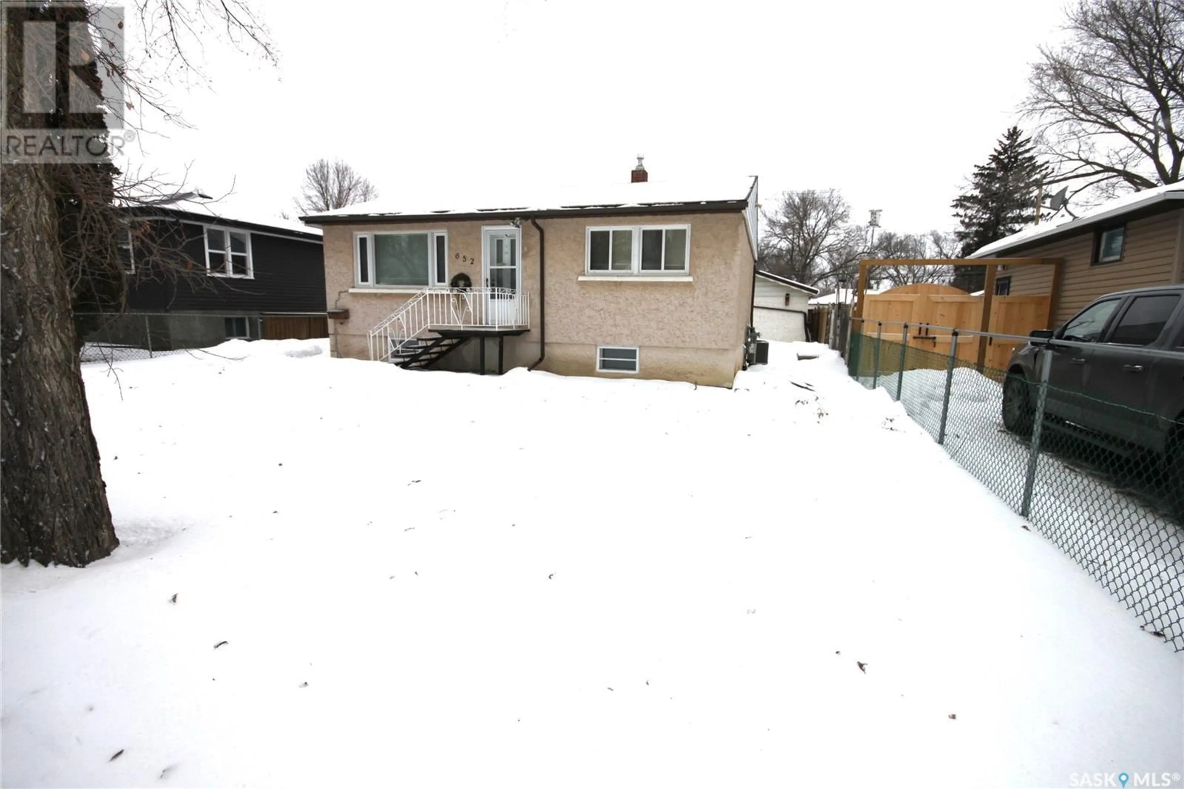 Frontside or backside of a home, the fenced backyard for 652 Princess STREET, Regina Saskatchewan S4T3X5