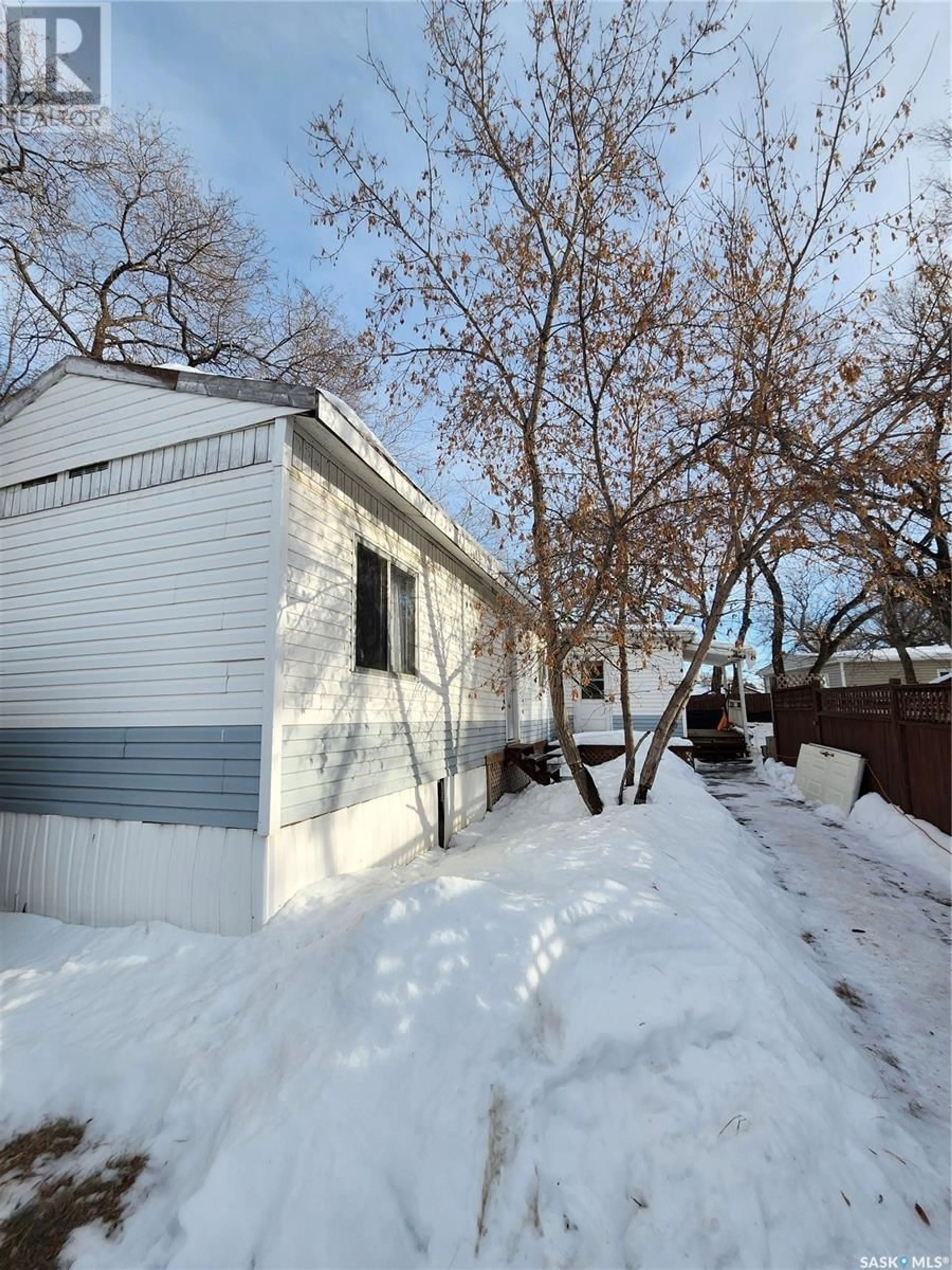 A pic from exterior of the house or condo, the fenced backyard for 102 1524 Rayner AVENUE, Saskatoon Saskatchewan S7N1Y1