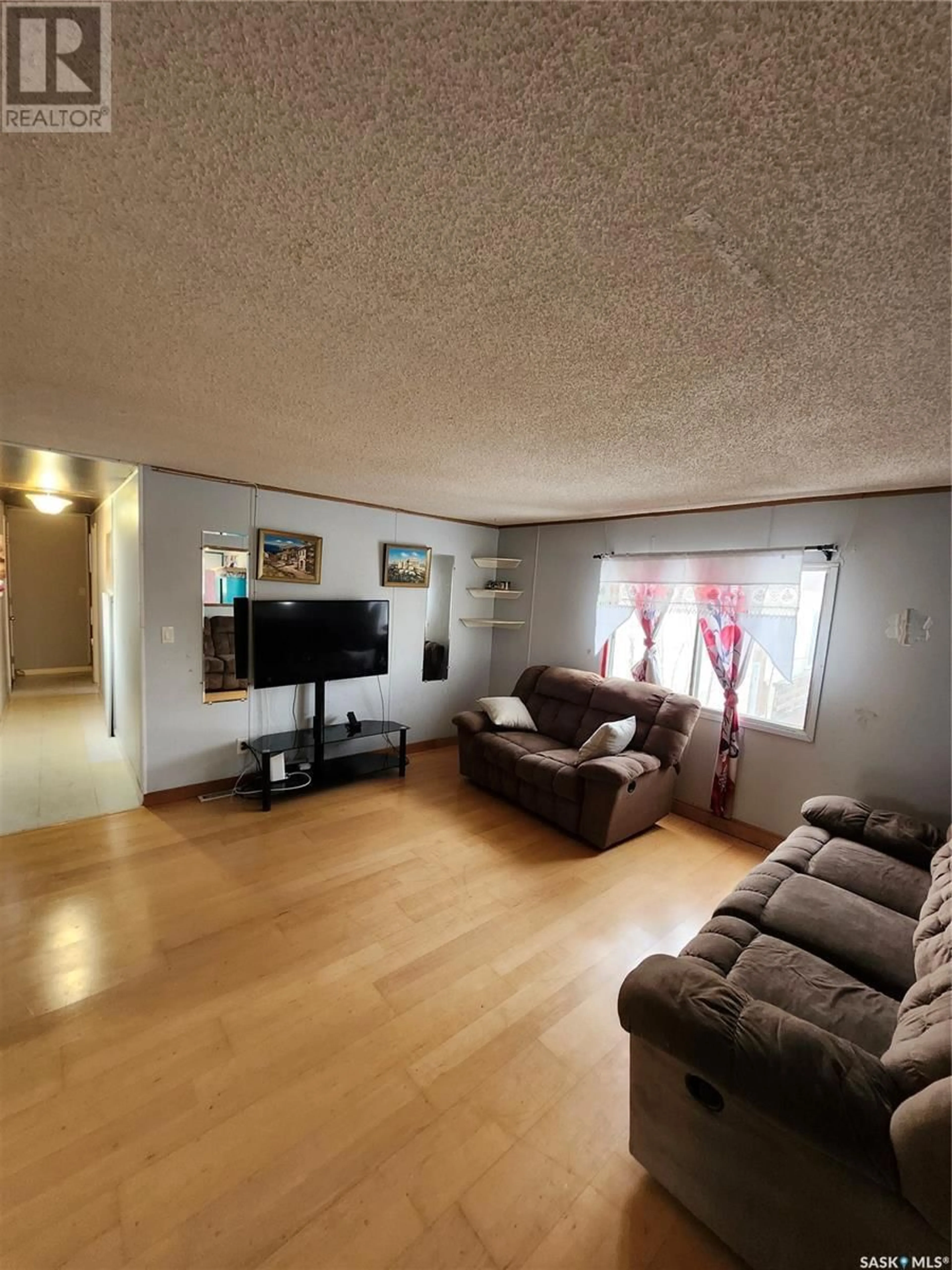 A pic of a room, wood floors for 102 1524 Rayner AVENUE, Saskatoon Saskatchewan S7N1Y1