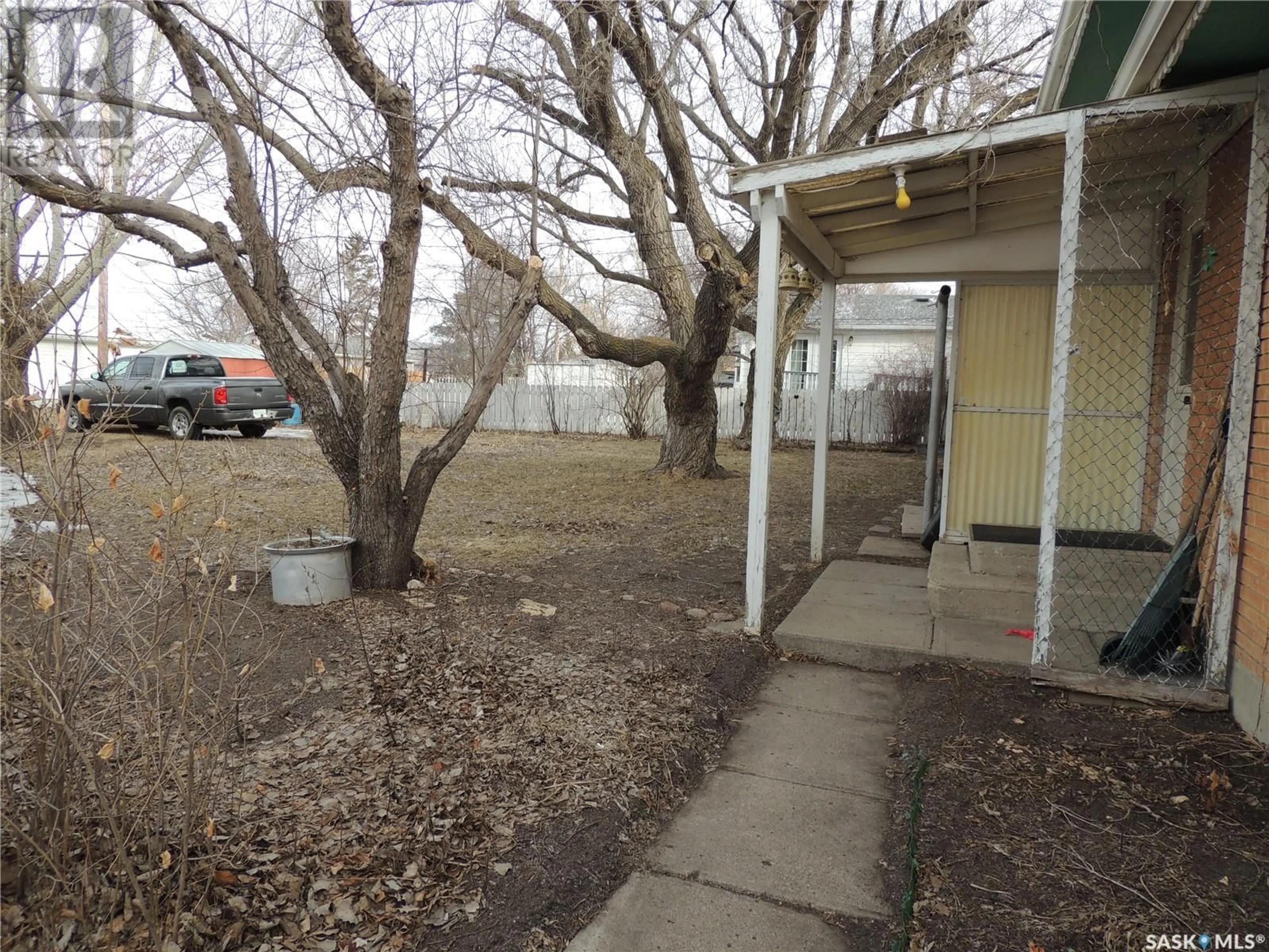 A pic from exterior of the house or condo, the fenced backyard for 503 Mcleod AVENUE, Estevan Saskatchewan S4A0B2