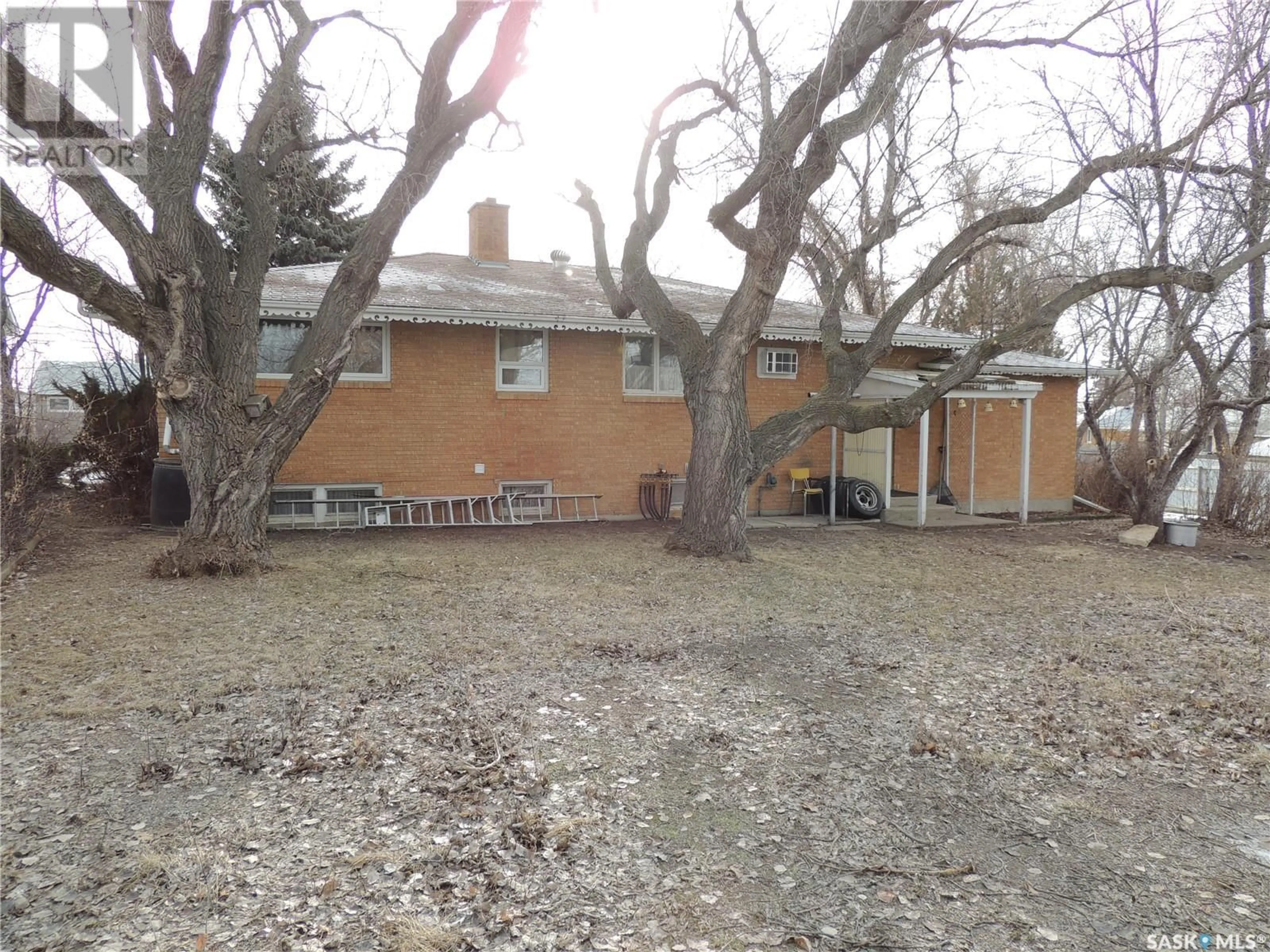 Frontside or backside of a home, the fenced backyard for 503 Mcleod AVENUE, Estevan Saskatchewan S4A0B2