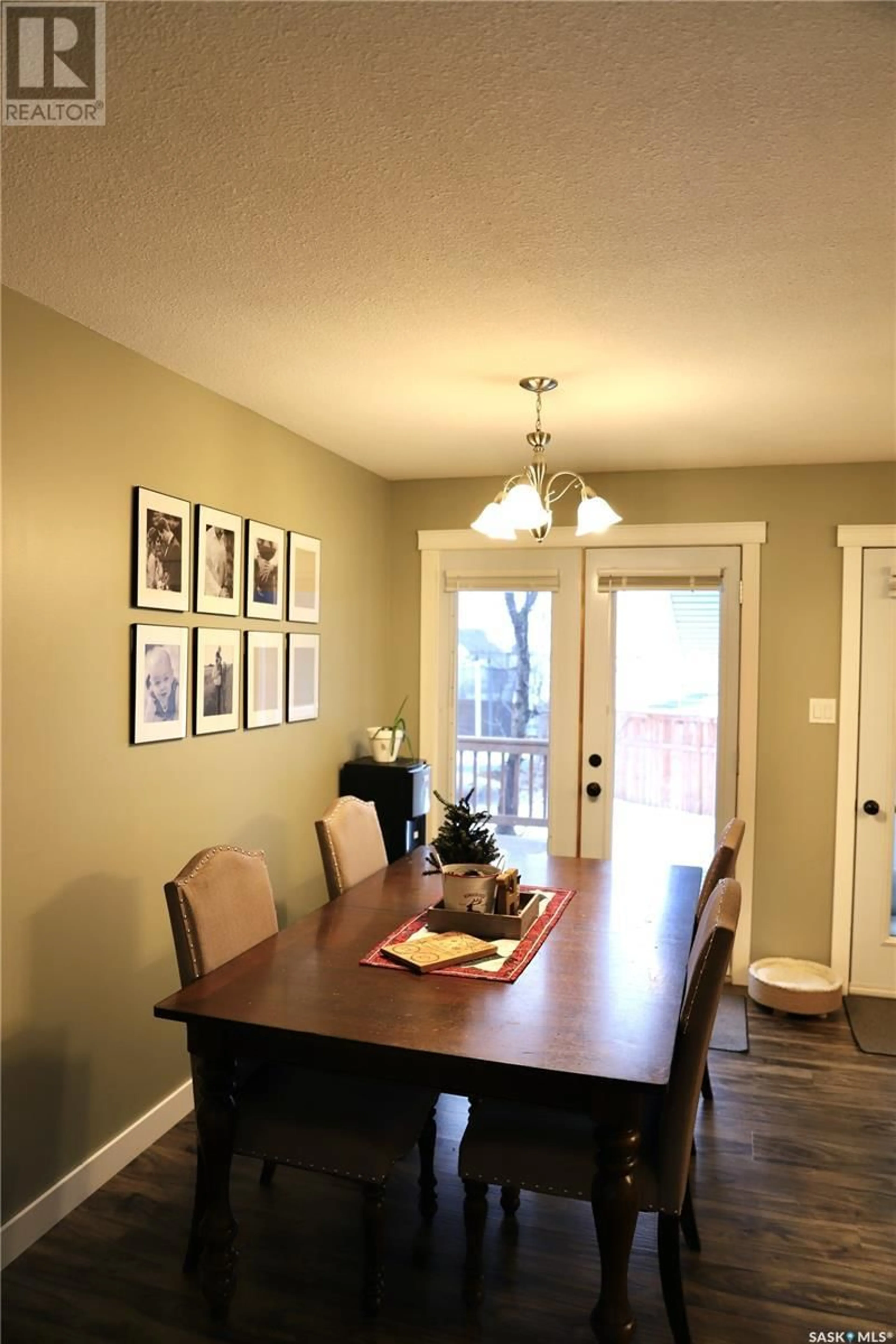 Dining room, wood/laminate floor for 713 Chambers COURT, Shellbrook Saskatchewan S0J2E0