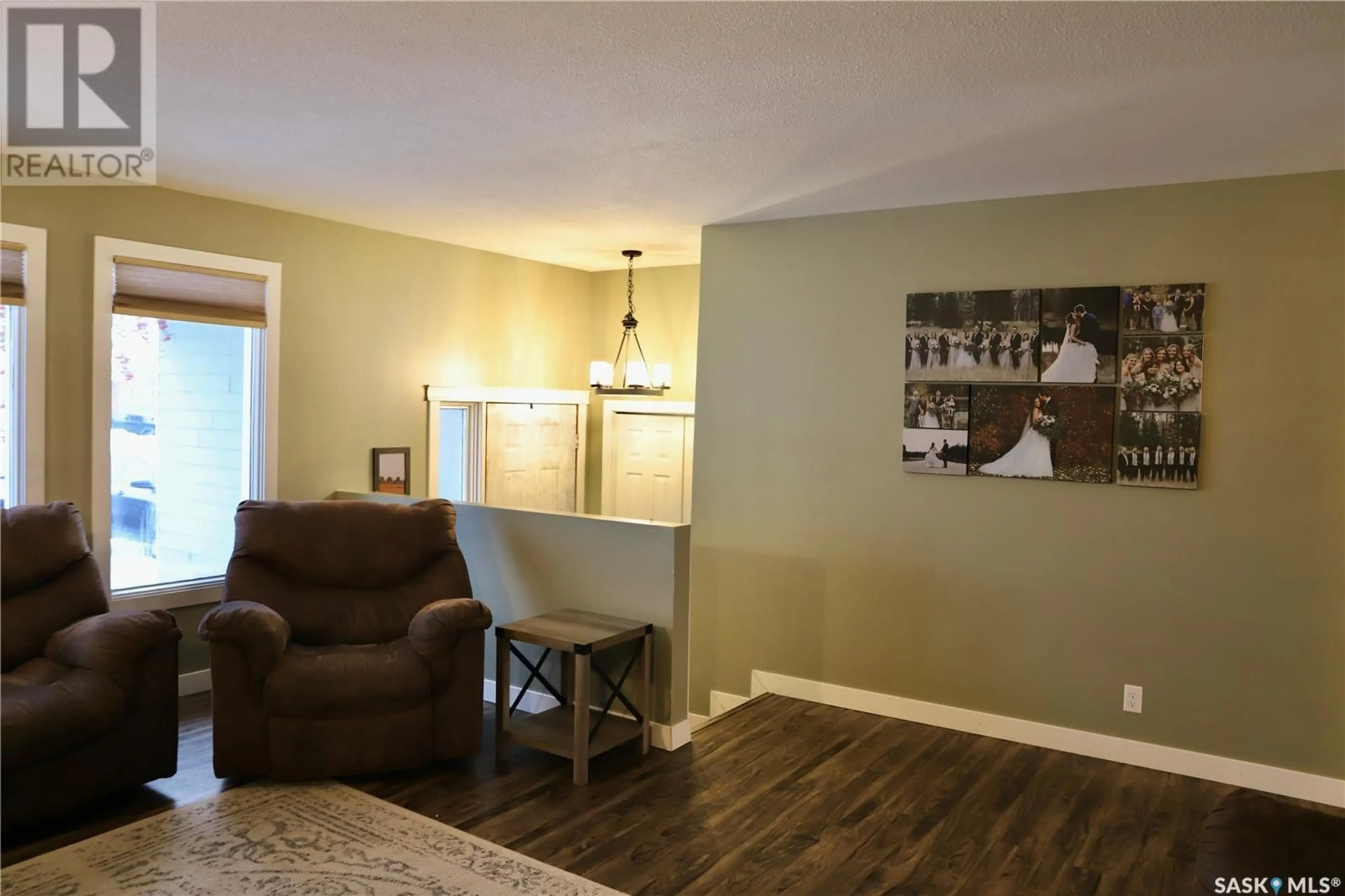 Living room with furniture, wood/laminate floor for 713 Chambers COURT, Shellbrook Saskatchewan S0J2E0