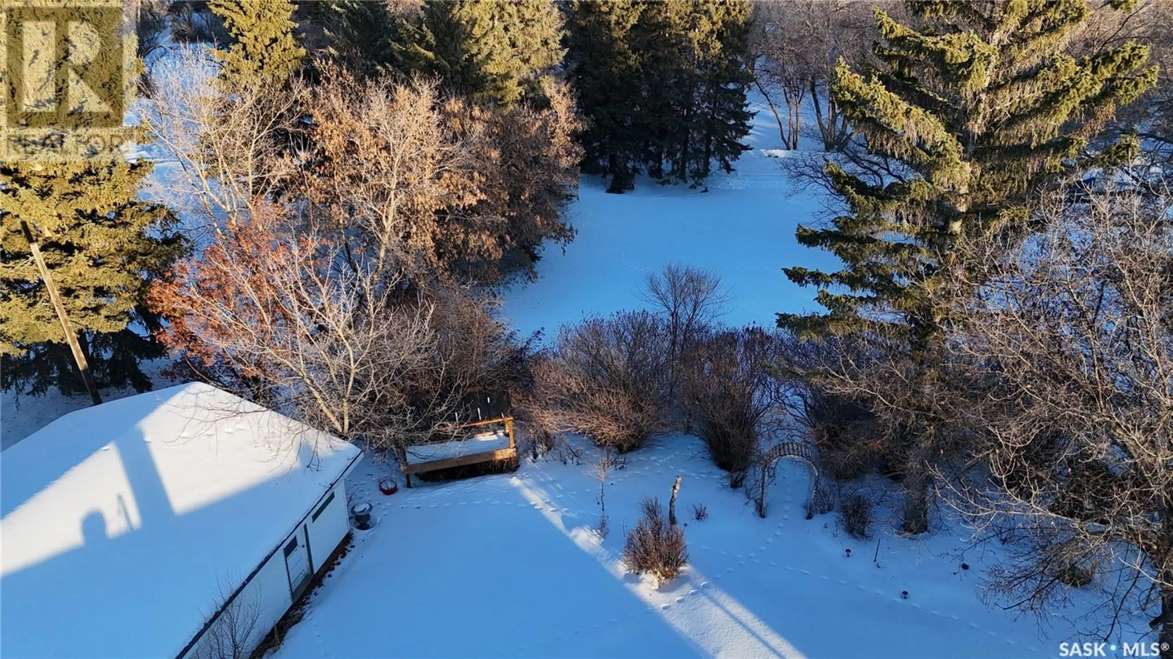 A pic from outside/outdoor area/front of a property/back of a property/a pic from drone, forest/trees view for 1182 112TH STREET, North Battleford Saskatchewan S9A2L5