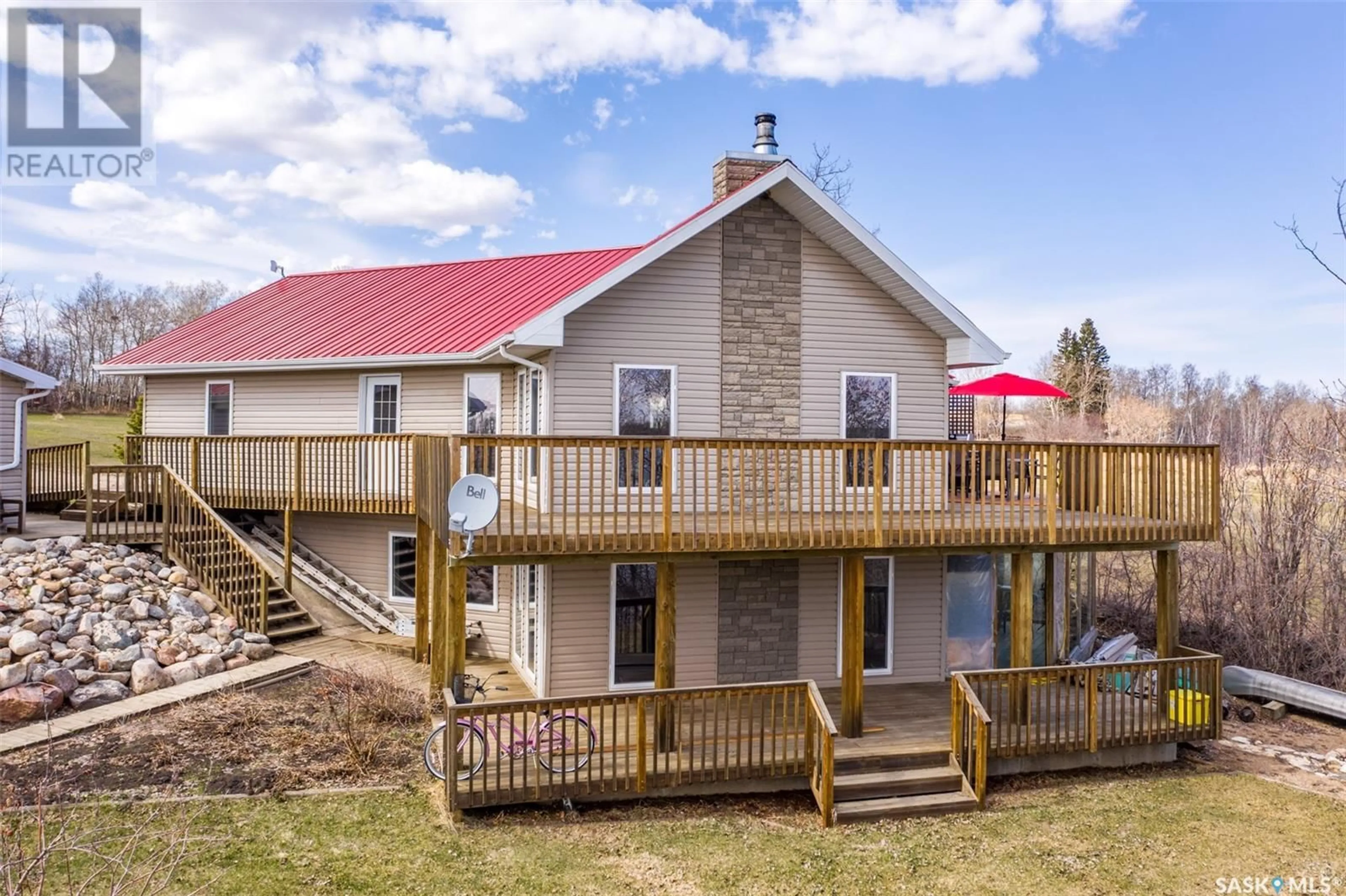 A pic from outside/outdoor area/front of a property/back of a property/a pic from drone, building for 128 Bouchard LANE, Dixon Lake Saskatchewan S0K1A0