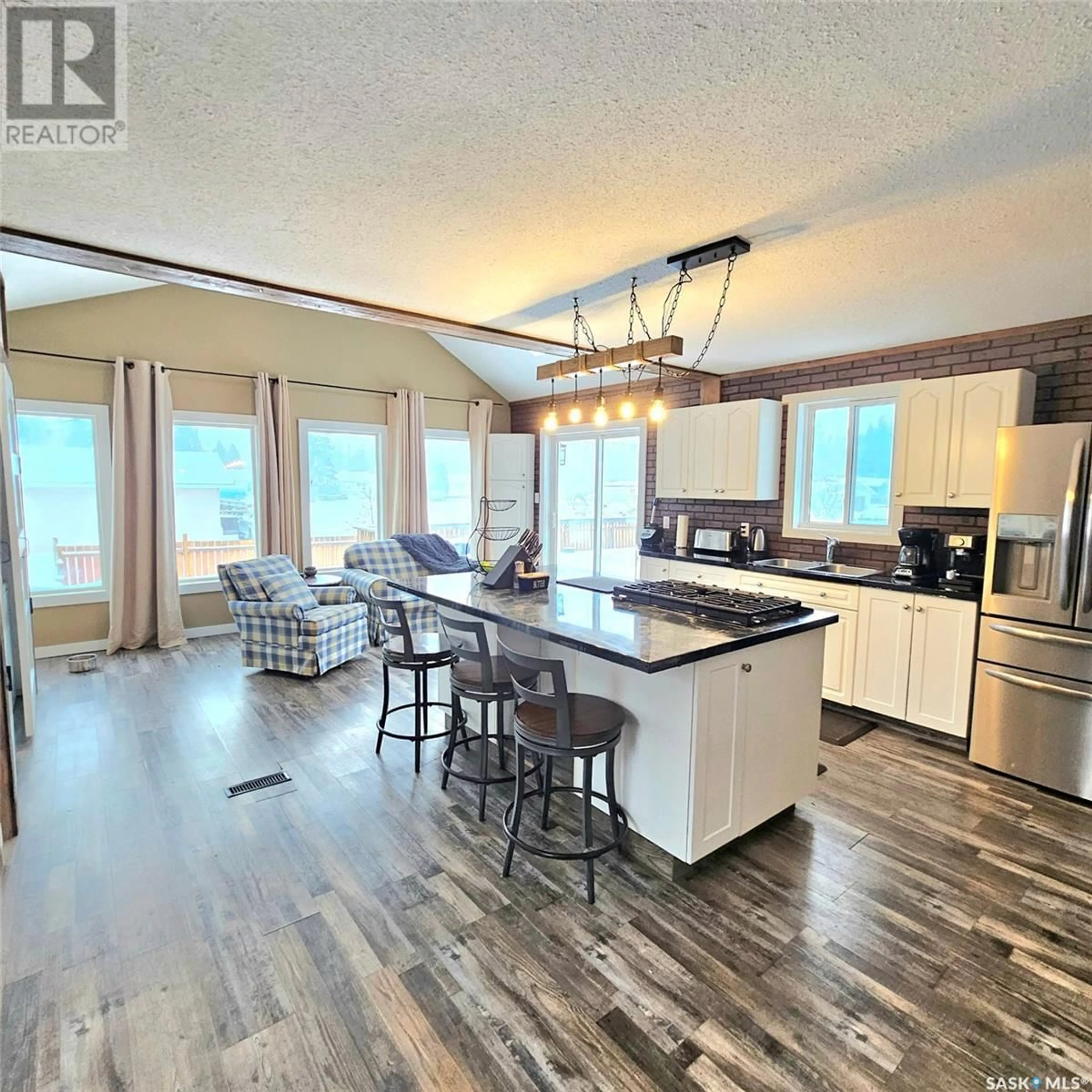 Open concept kitchen, wood/laminate floor for 201 7th STREET E, Choiceland Saskatchewan S0J0M0