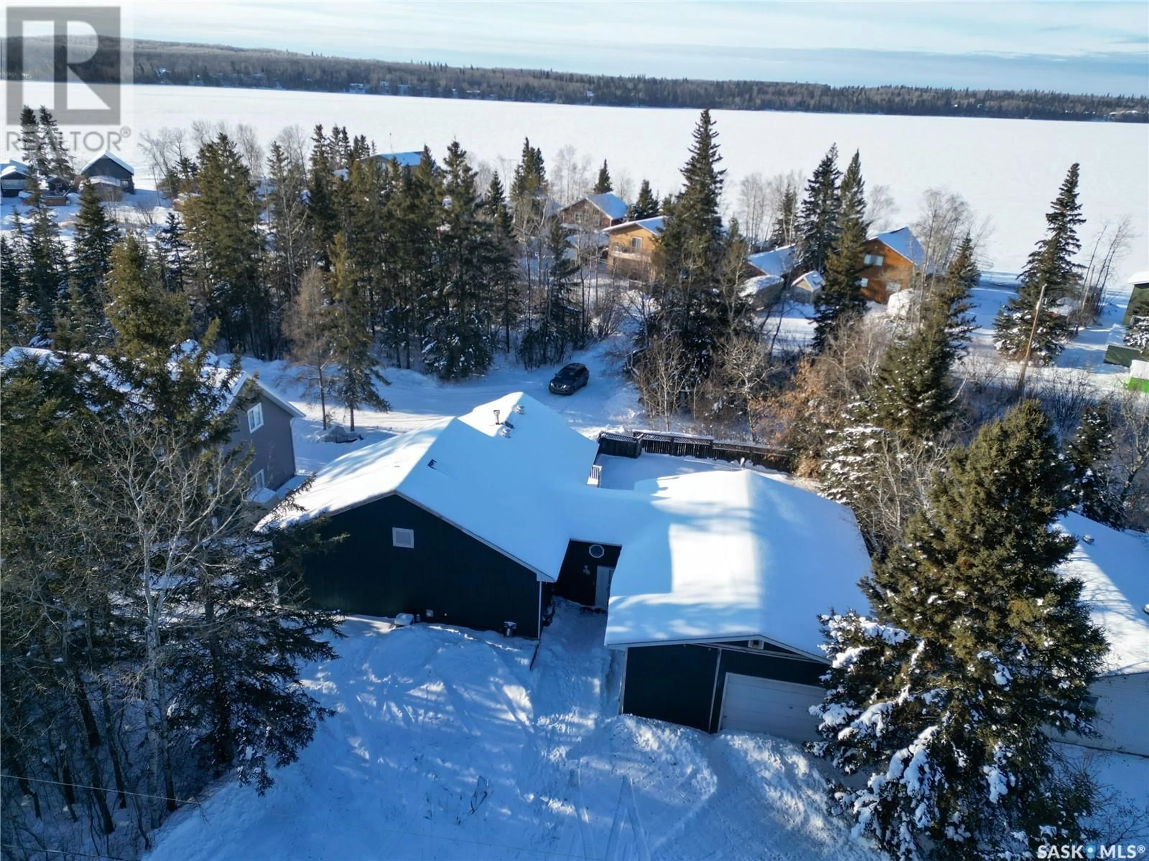 A pic from outside/outdoor area/front of a property/back of a property/a pic from drone, water/lake/river/ocean view for 232 Jacobson DRIVE, Christopher Lake Saskatchewan S0J0N0