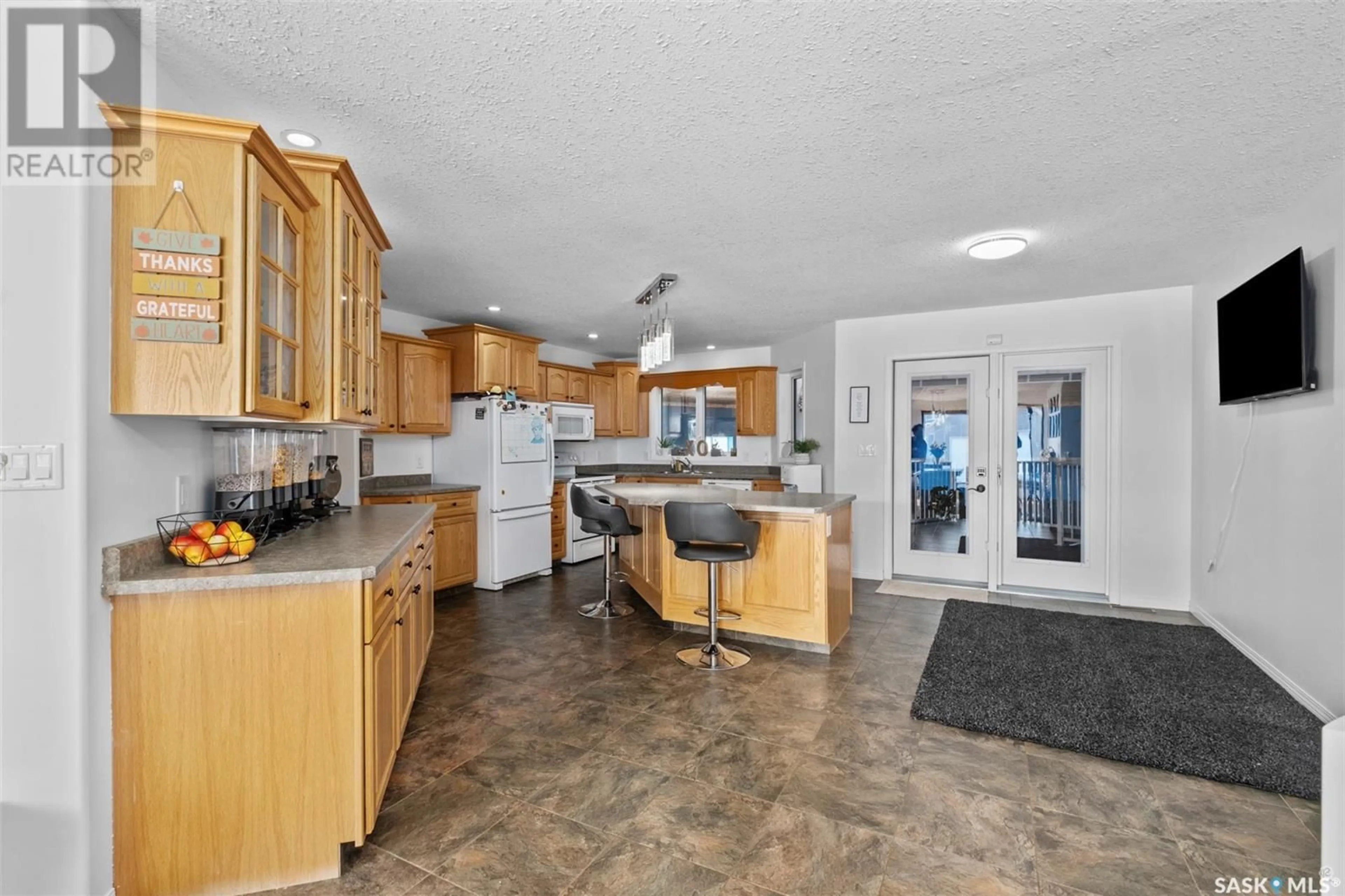 Open concept kitchen, ceramic/tile floor for 1 Poplar CRESCENT, Birch Hills Saskatchewan S0J0G0