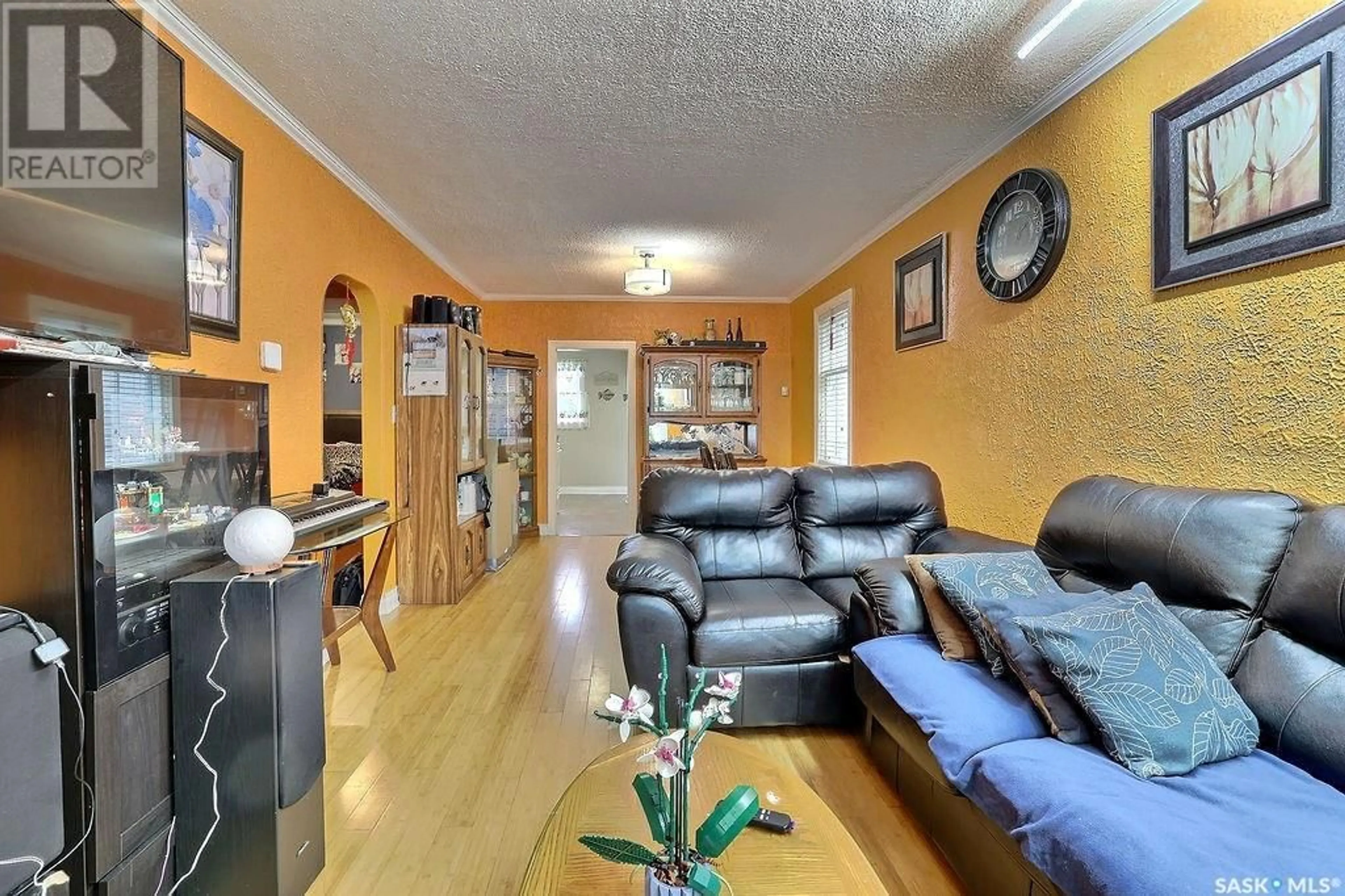 Living room with furniture, wood/laminate floor for 2077 Elliott STREET, Regina Saskatchewan S4N3G8