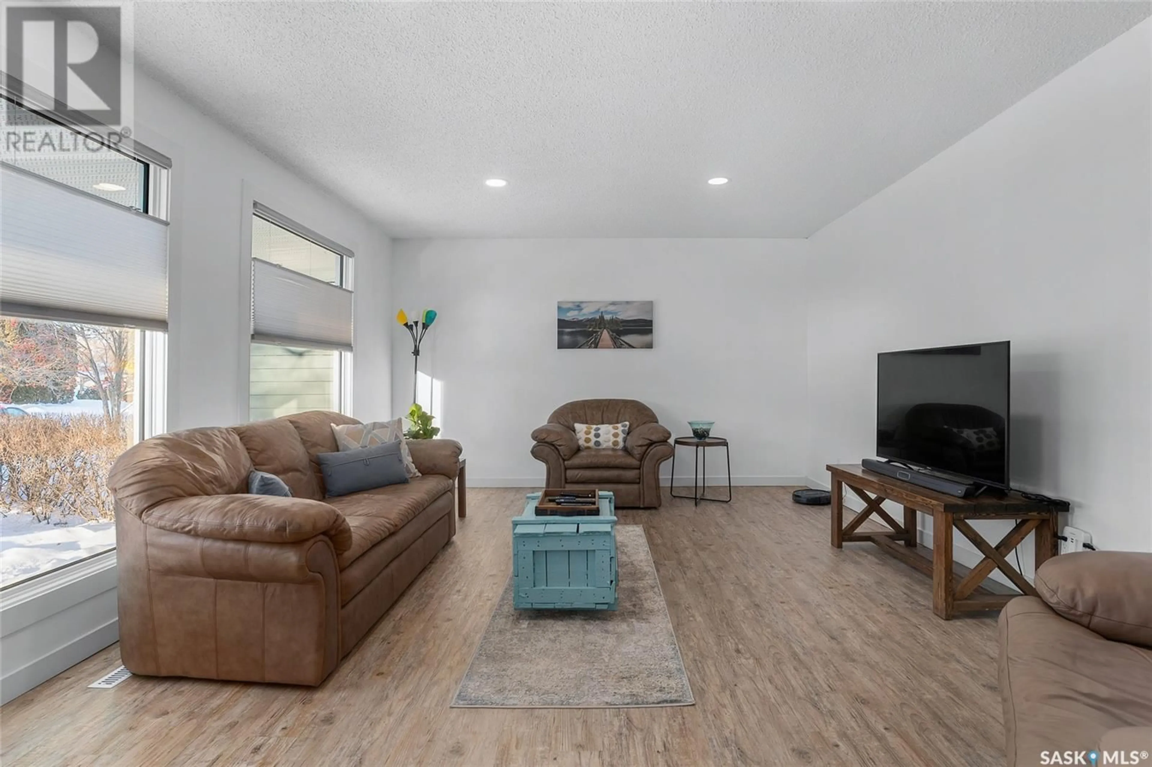 Living room with furniture, wood/laminate floor for 50 Richmond CRESCENT, Saskatoon Saskatchewan S7K1A8