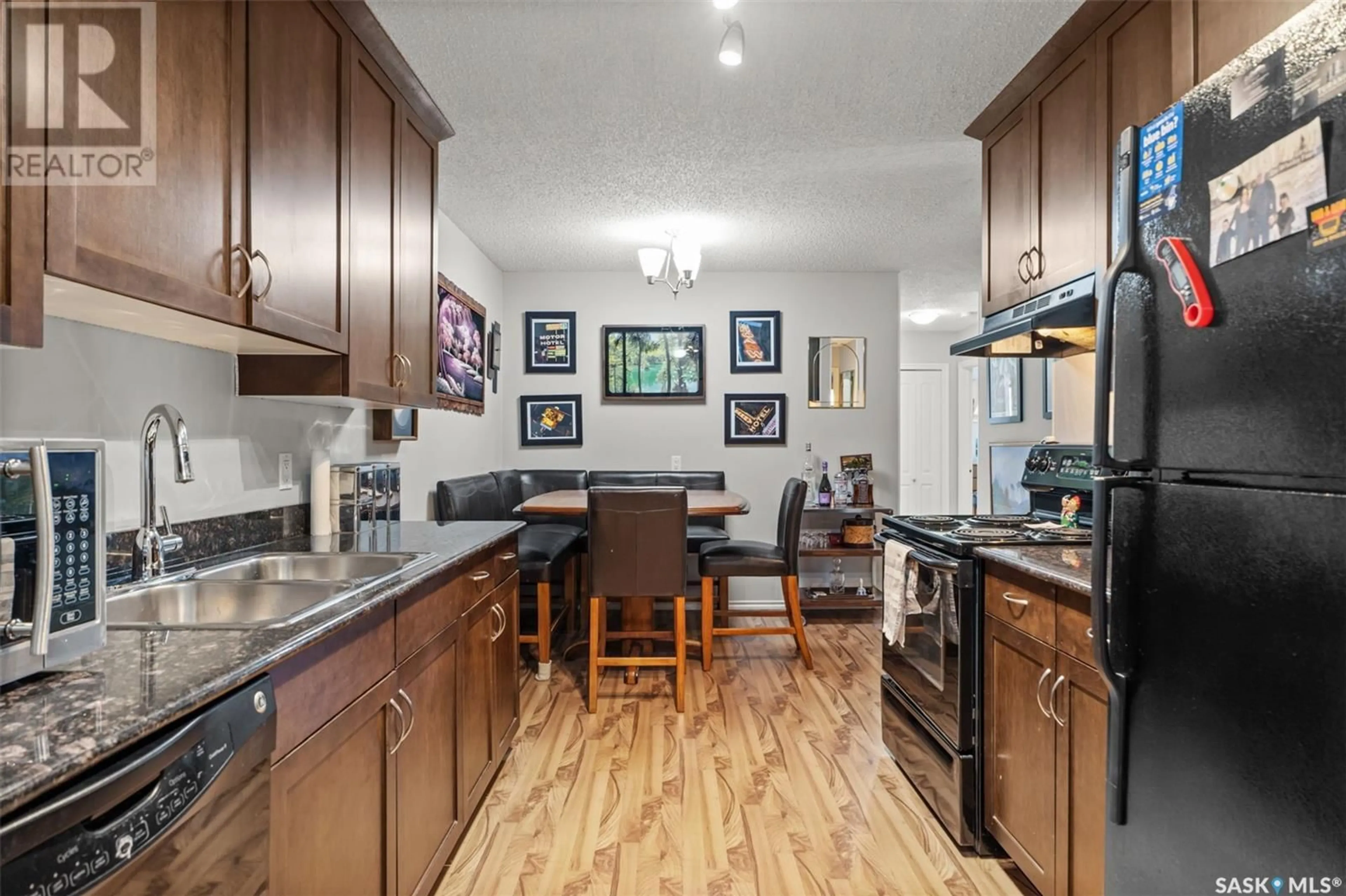 Open concept kitchen, unknown for 319 2233 St Henry AVENUE, Saskatoon Saskatchewan S7M5K6