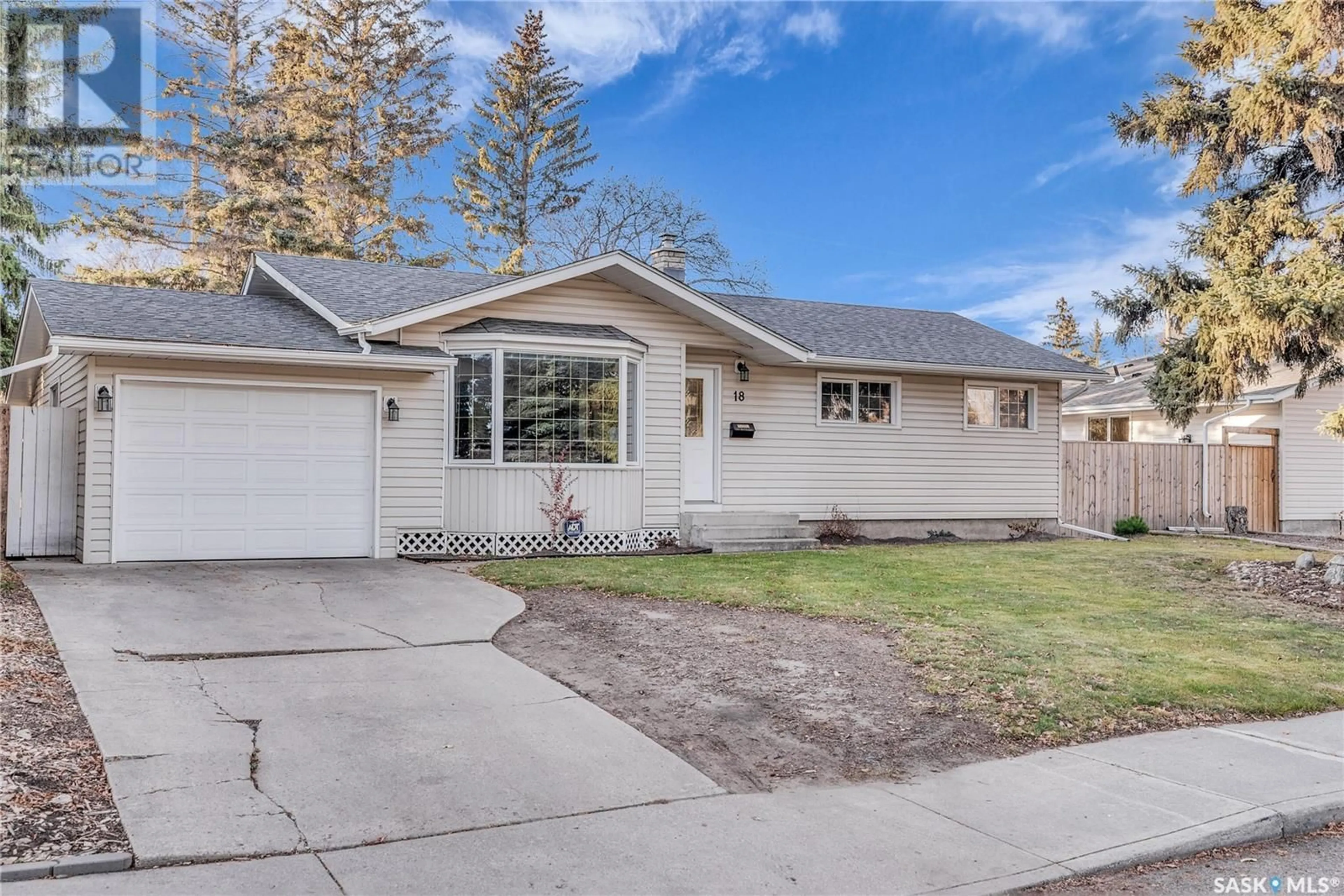 Home with vinyl exterior material, street for 18 Hoeschen CRESCENT, Saskatoon Saskatchewan S7J2T1