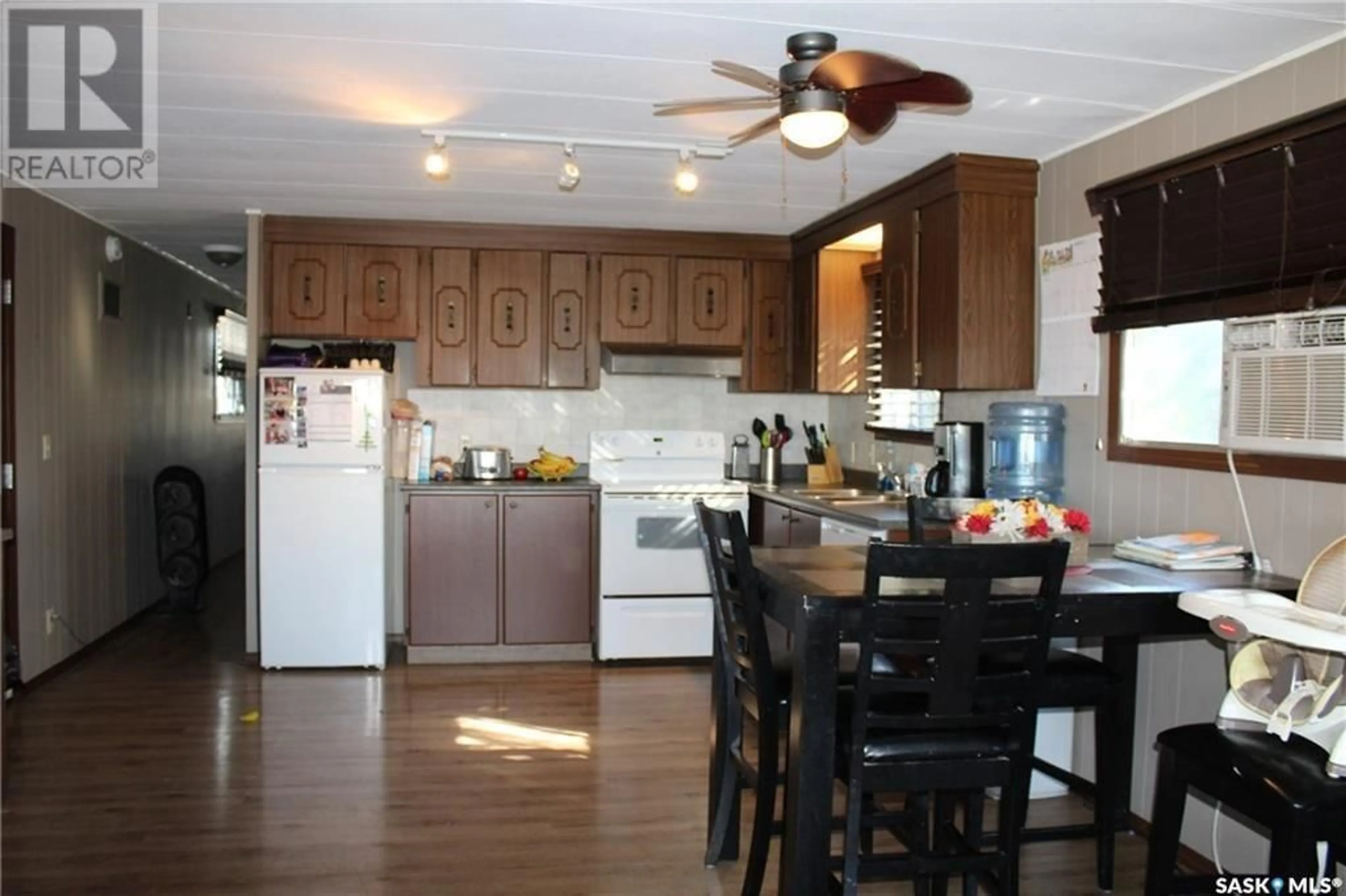 Open concept kitchen, wood/laminate floor for 508 Railway AVENUE, Lampman Saskatchewan S0C1N0