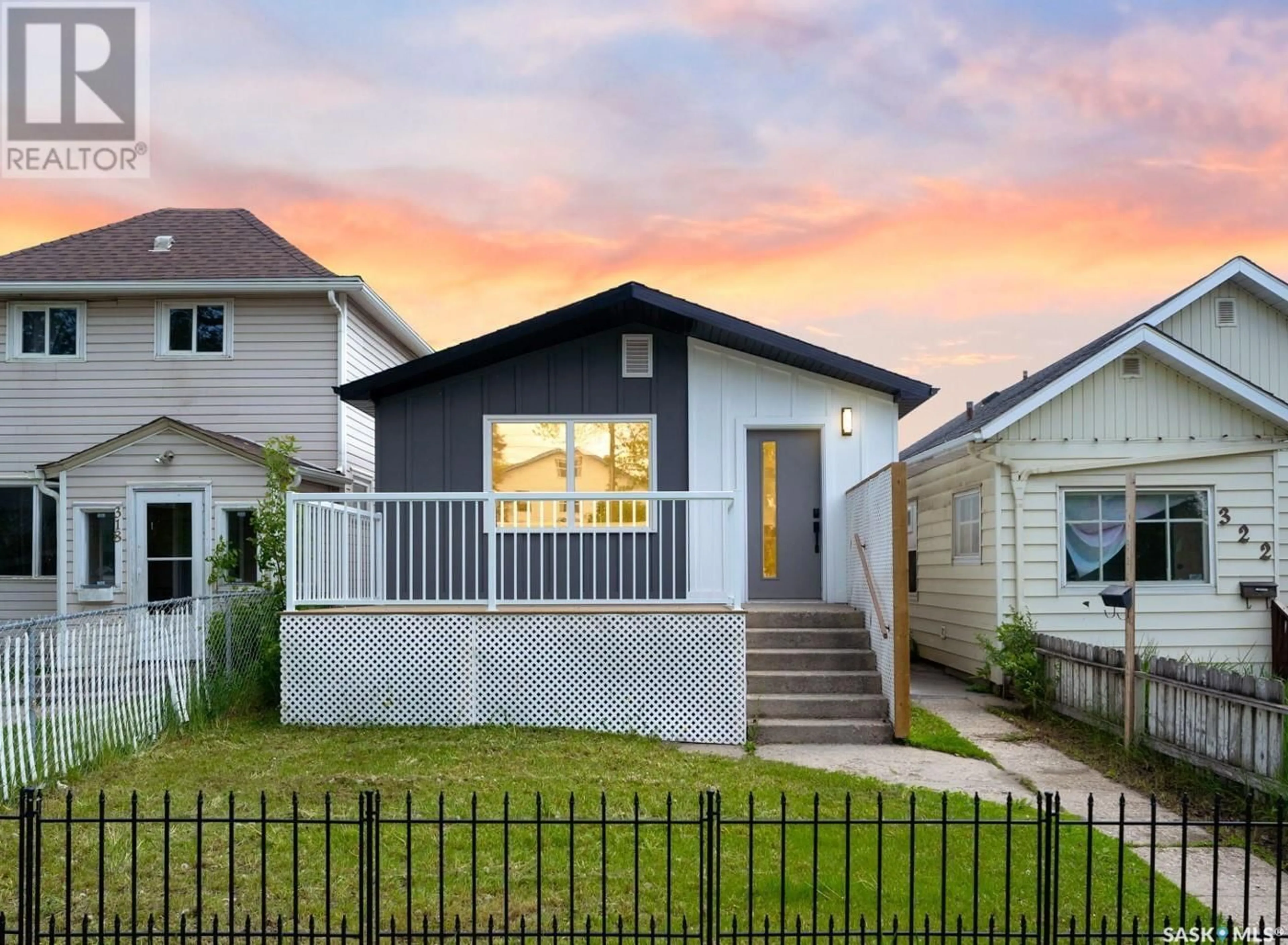 Home with vinyl exterior material, street for 320 H AVENUE S, Saskatoon Saskatchewan S7M1W3