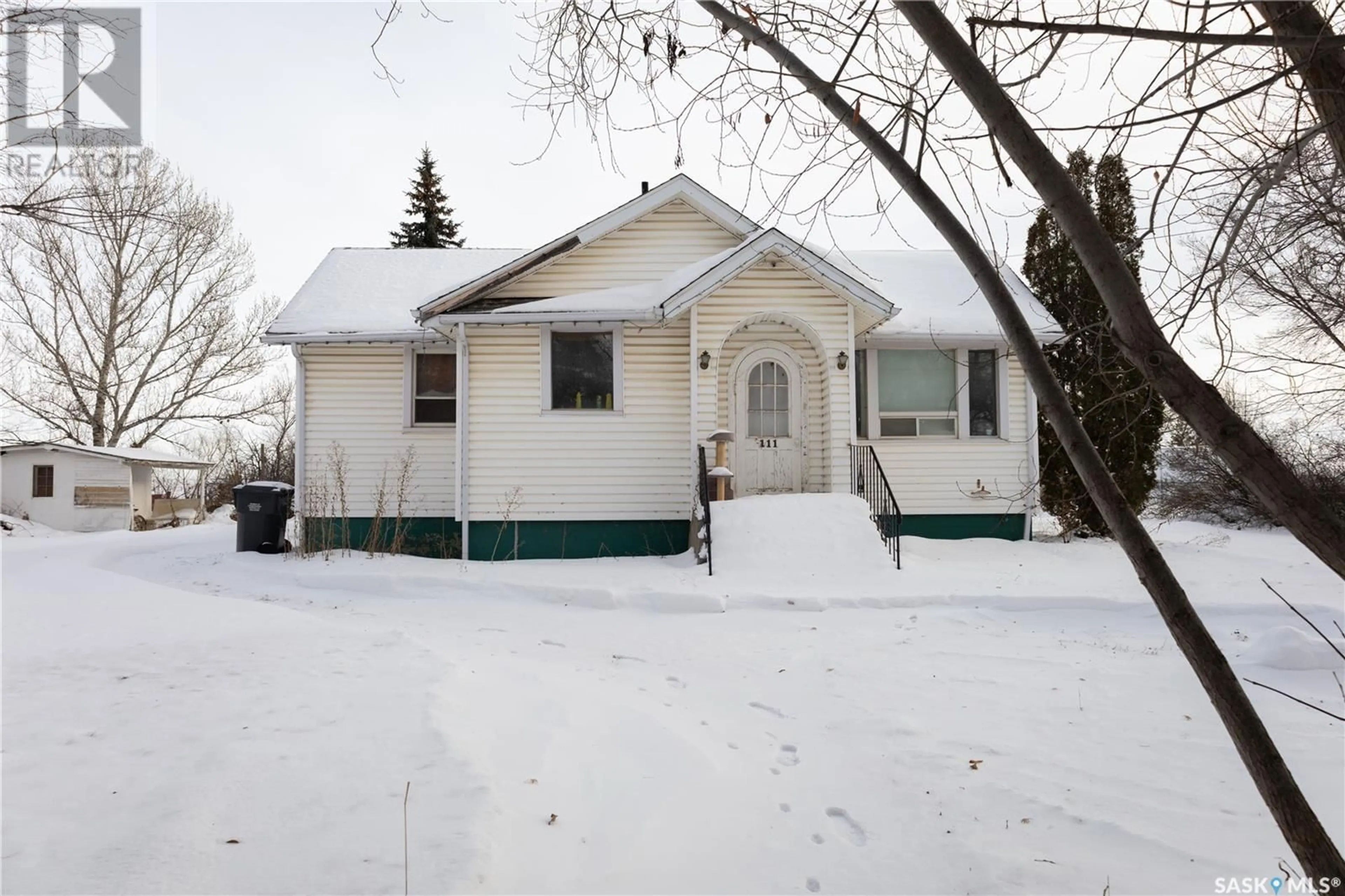 Home with vinyl exterior material, street for 111 Government ROAD, Dundurn Saskatchewan S0K1K0