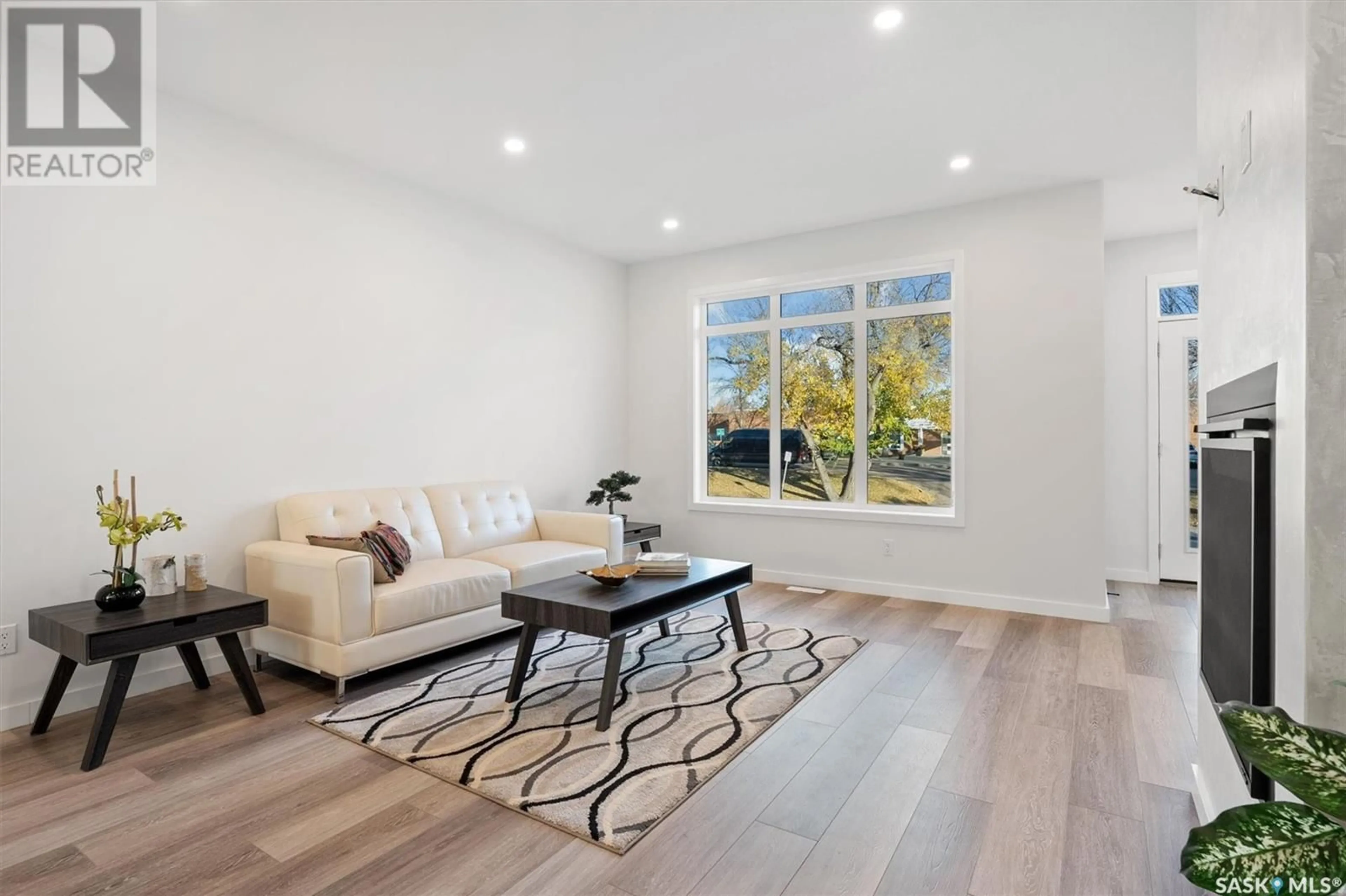 Living room with furniture, wood/laminate floor for 1336 COLONY STREET, Saskatoon Saskatchewan S7N0S7