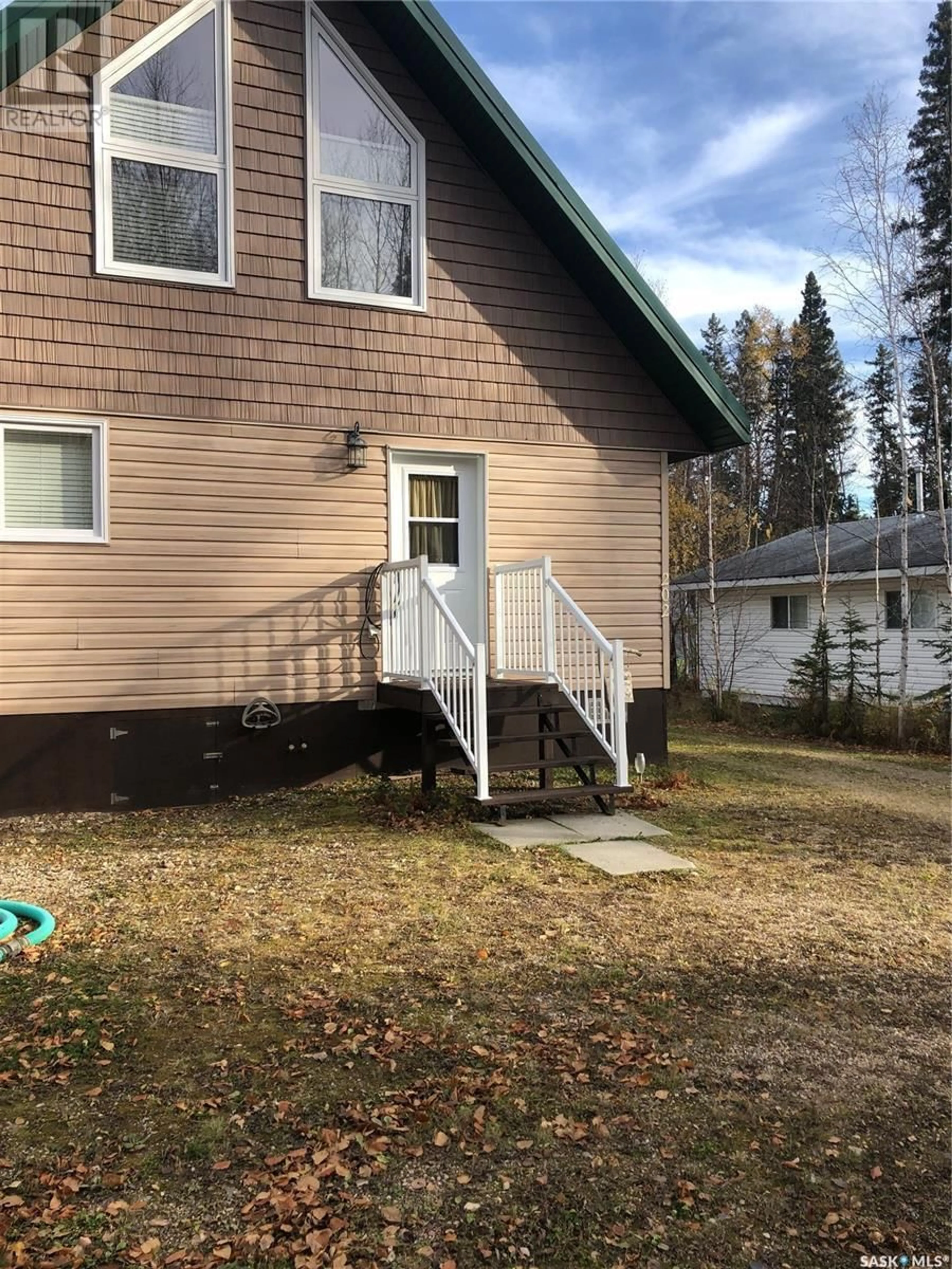 Home with vinyl exterior material, street for 11 - 2 SPRUCE CRESCENT, Dore Lake Saskatchewan S0M1B0