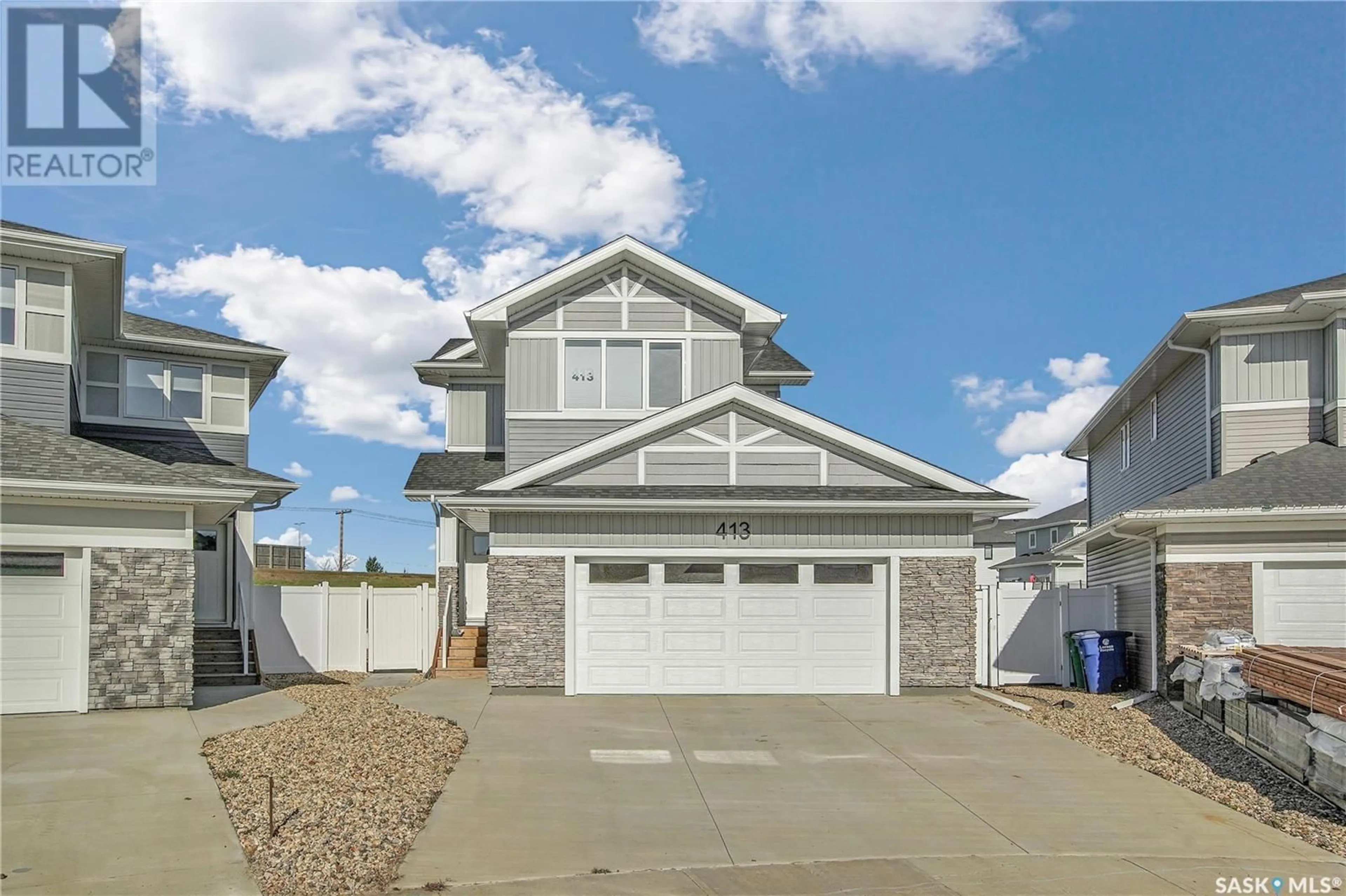 Home with vinyl exterior material, street for 413 Germain MANOR, Saskatoon Saskatchewan S7V0V1