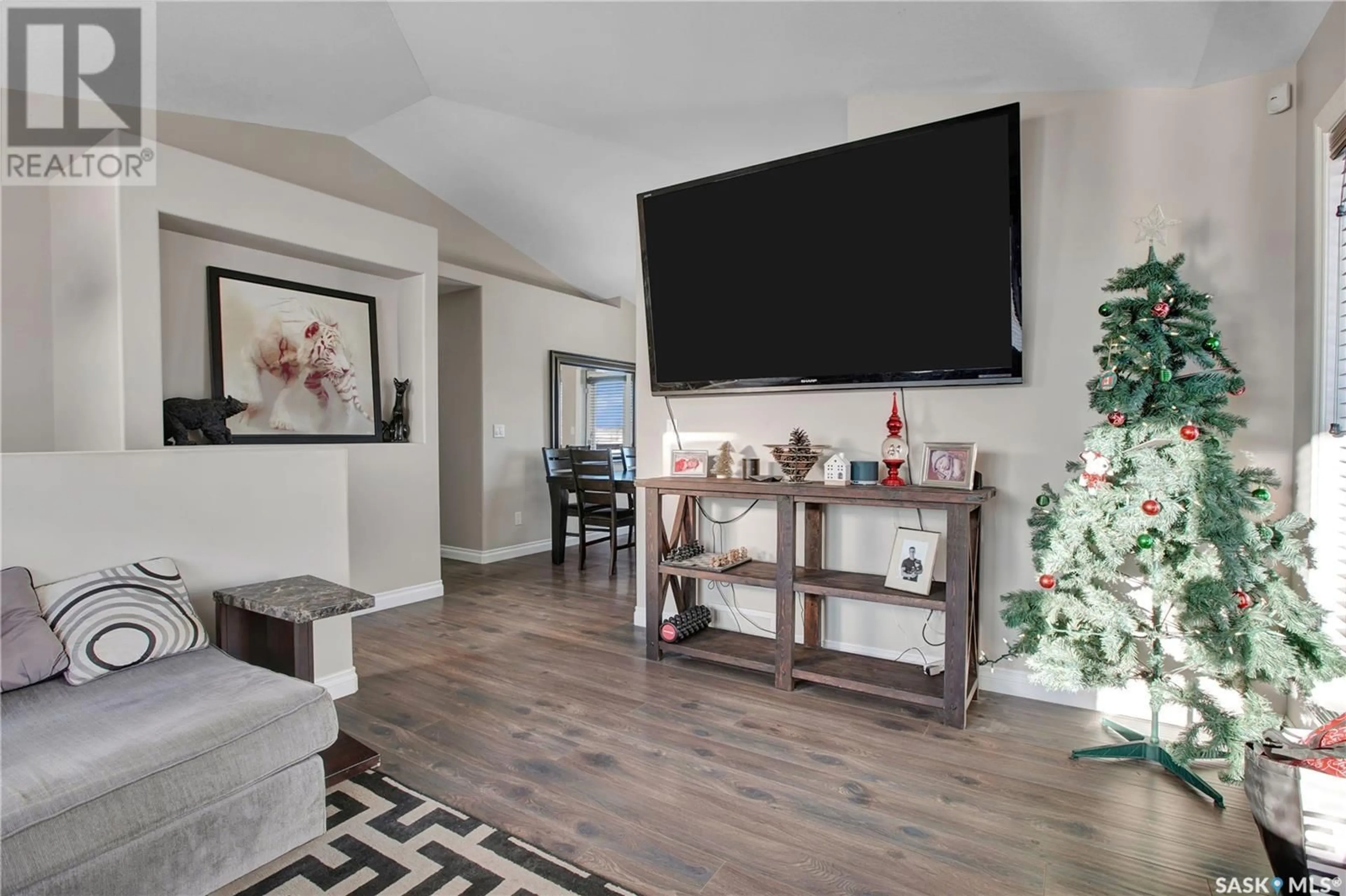 Living room with furniture, wood/laminate floor for 302 Lehrer MANOR, Saskatoon Saskatchewan S7R0L4