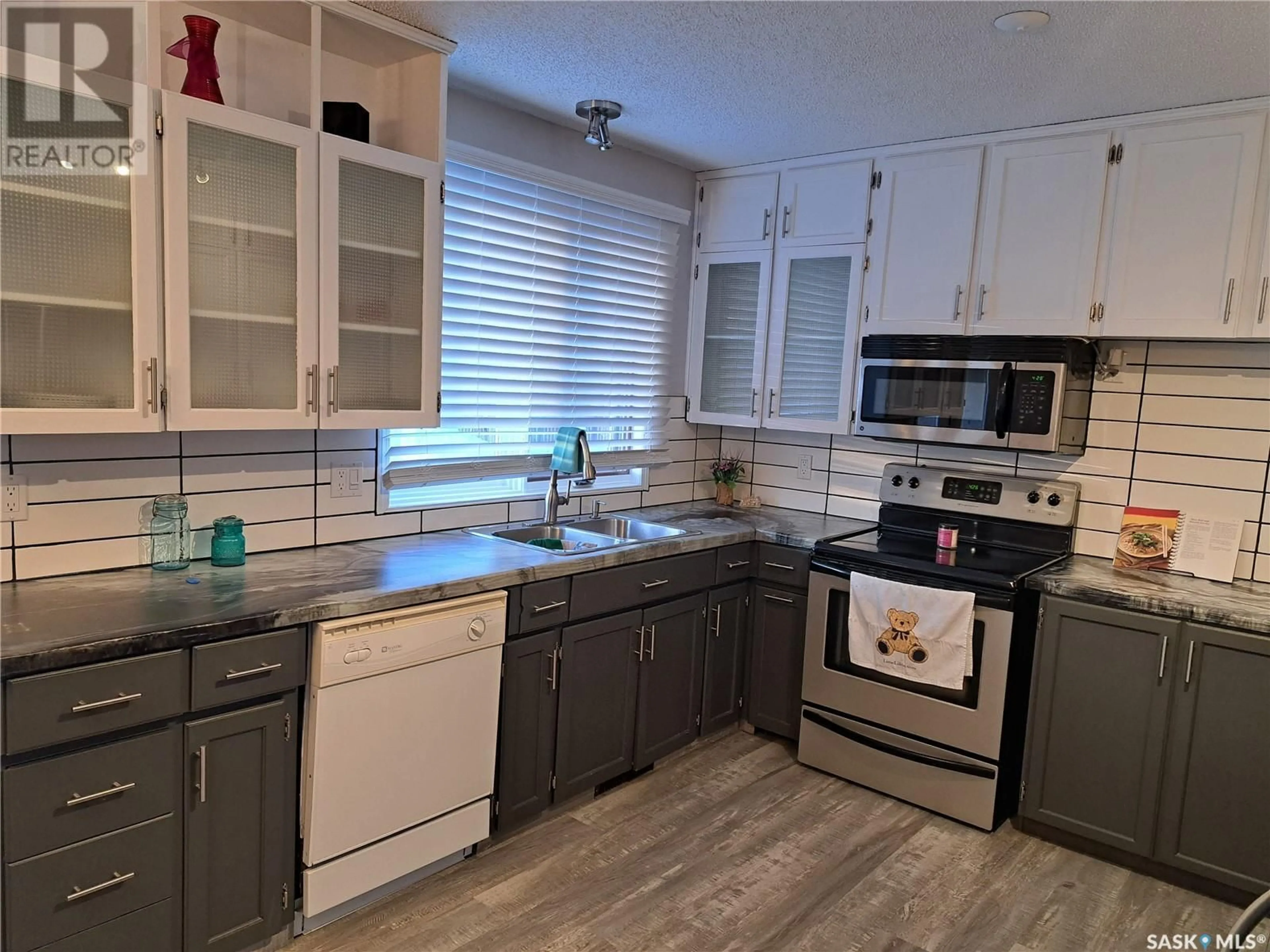 Open concept kitchen, ceramic/tile floor for 230 Ash STREET, Outlook Saskatchewan S0L2N0