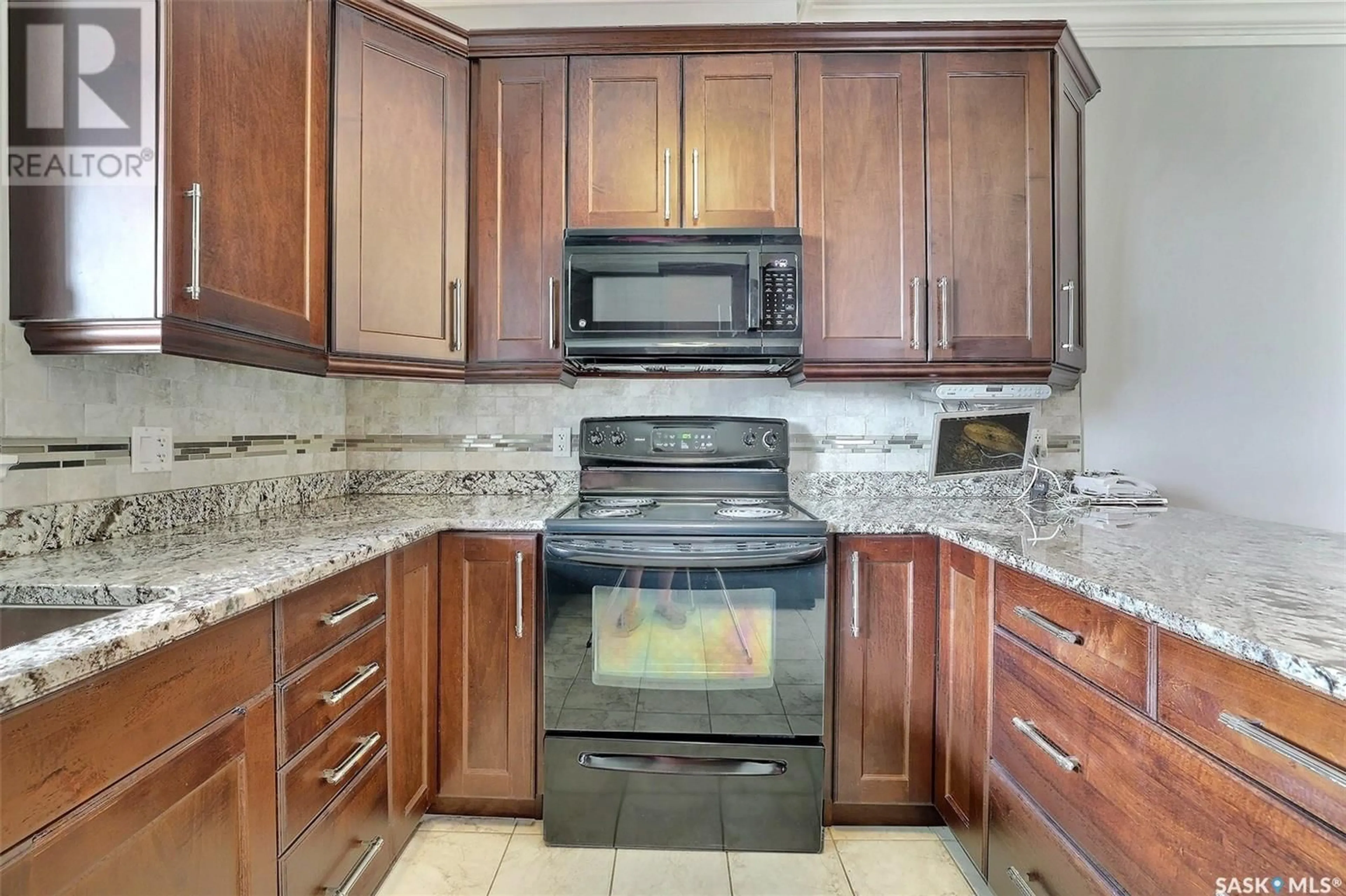 Standard kitchen, ceramic/tile floor for 305 3750 Haughton ROAD E, Regina Saskatchewan S4V1R6