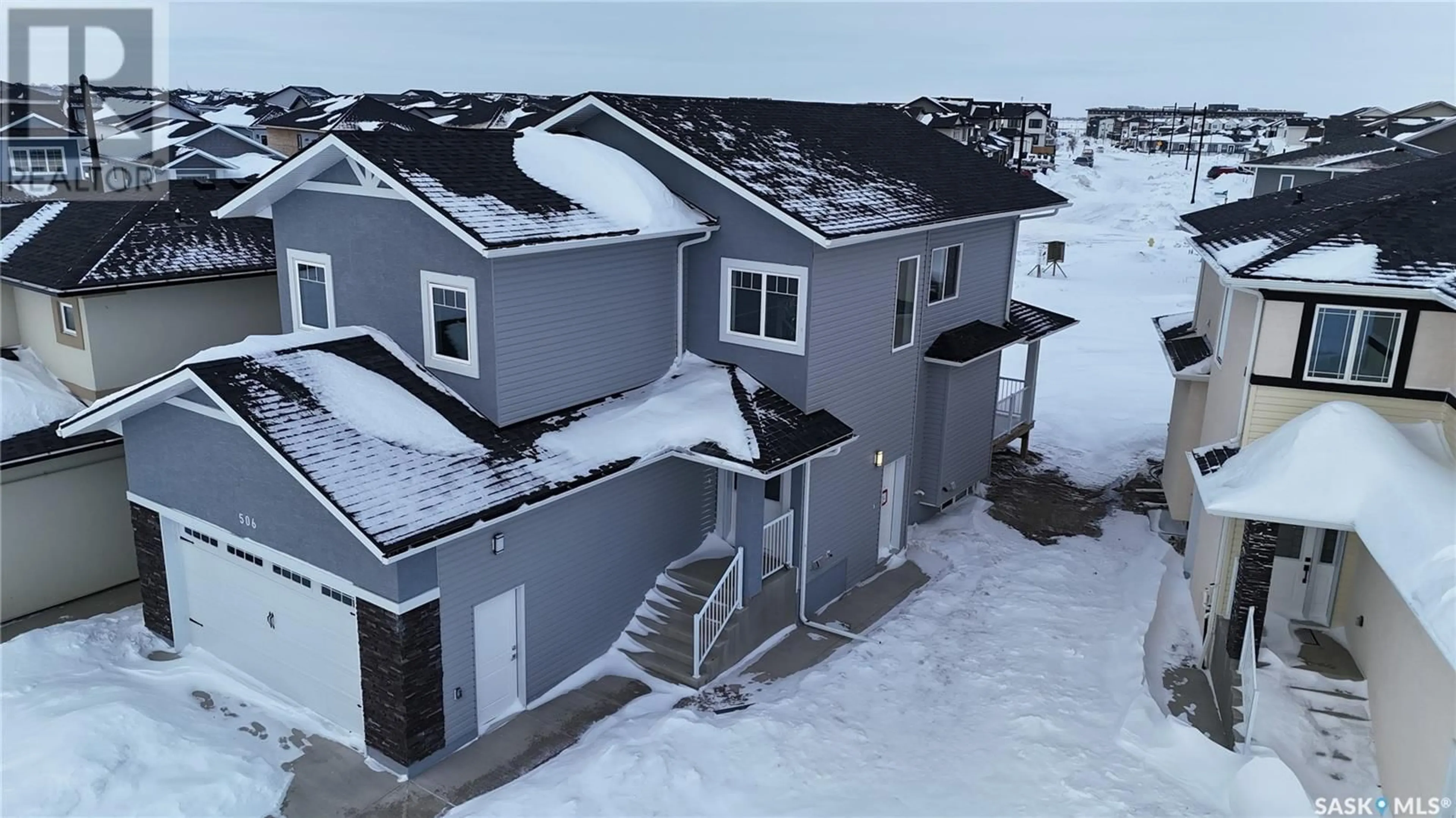 A pic from outside/outdoor area/front of a property/back of a property/a pic from drone, building for 506 Taskamanwa STREET, Saskatoon Saskatchewan S0K2T0