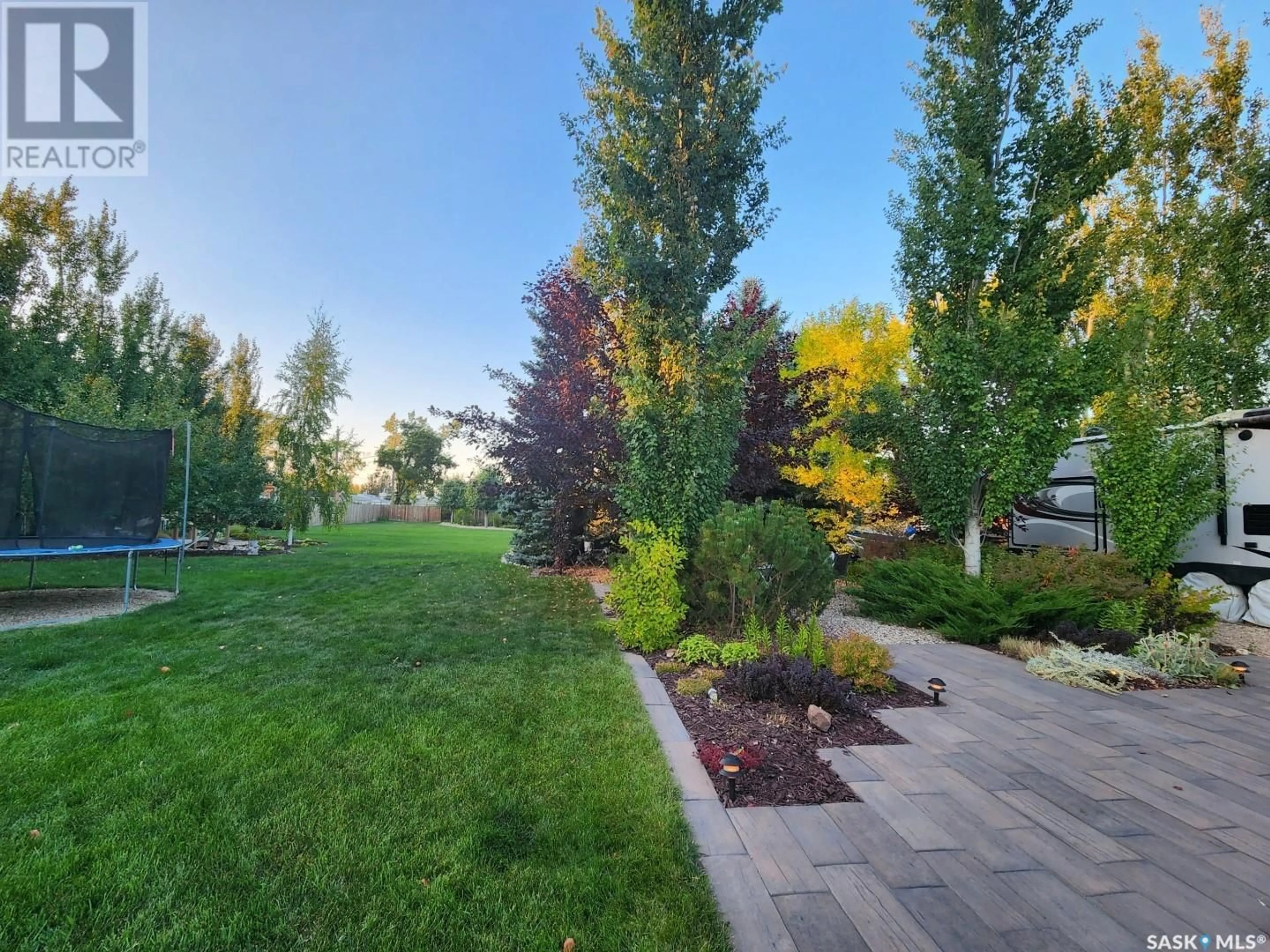 A pic from outside/outdoor area/front of a property/back of a property/a pic from drone, forest/trees view for 706 Grey AVENUE, Grenfell Saskatchewan S0G2B0