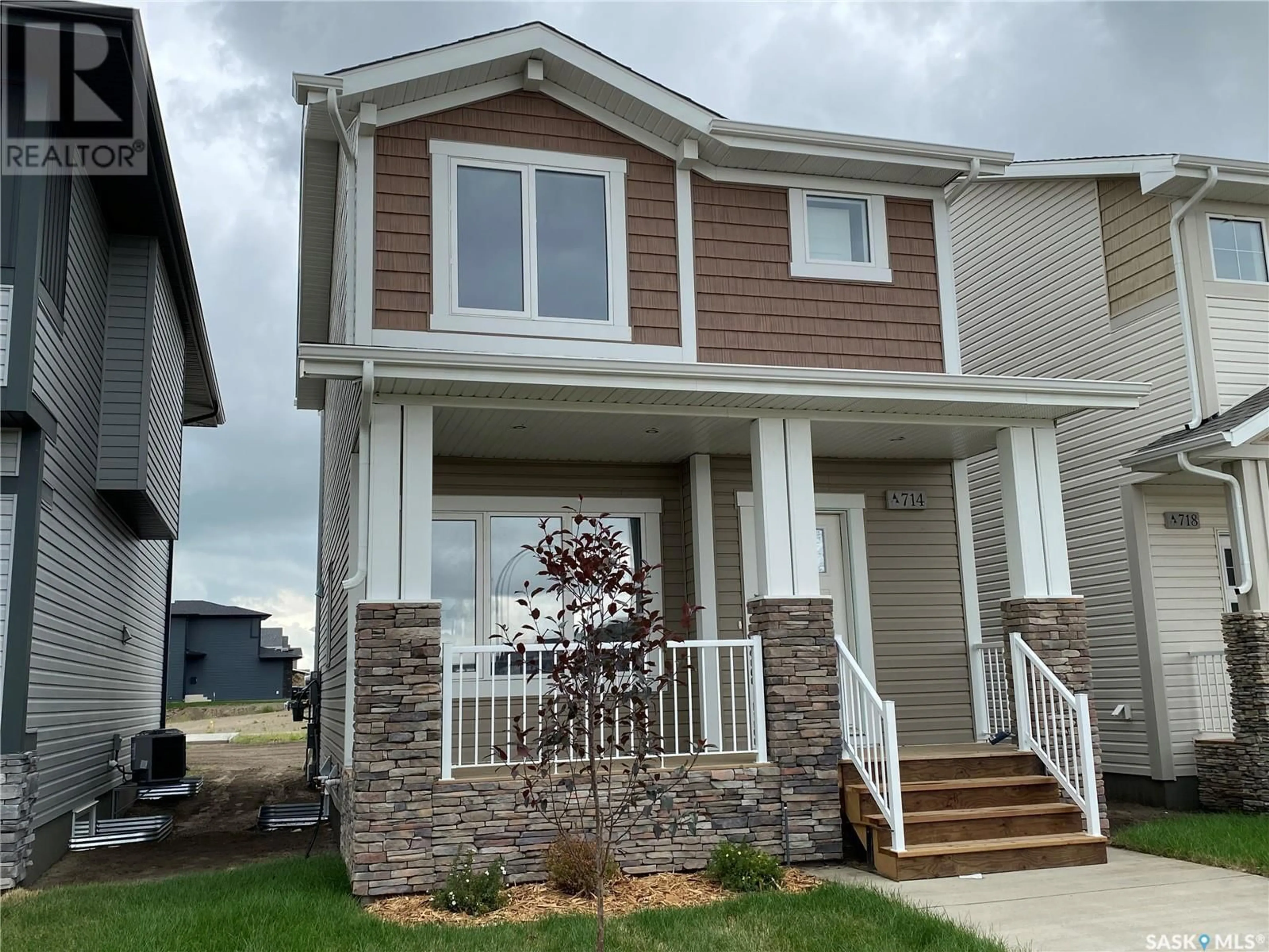 Home with vinyl exterior material, street for 171 Kostiuk CRESCENT, Saskatoon Saskatchewan S7V1R7