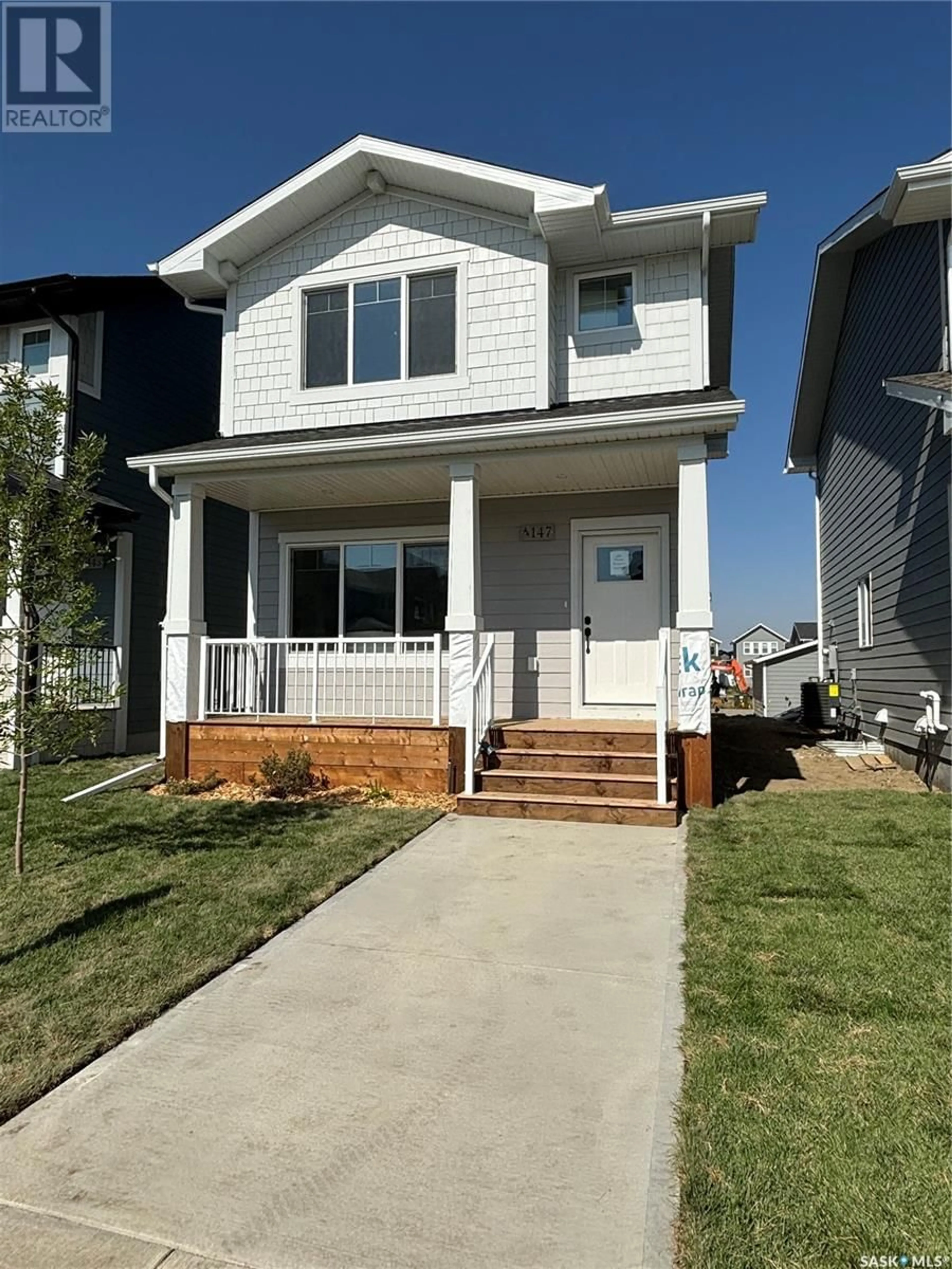 Home with vinyl exterior material, street for 183 Kostiuk CRESCENT, Saskatoon Saskatchewan S7V1R7