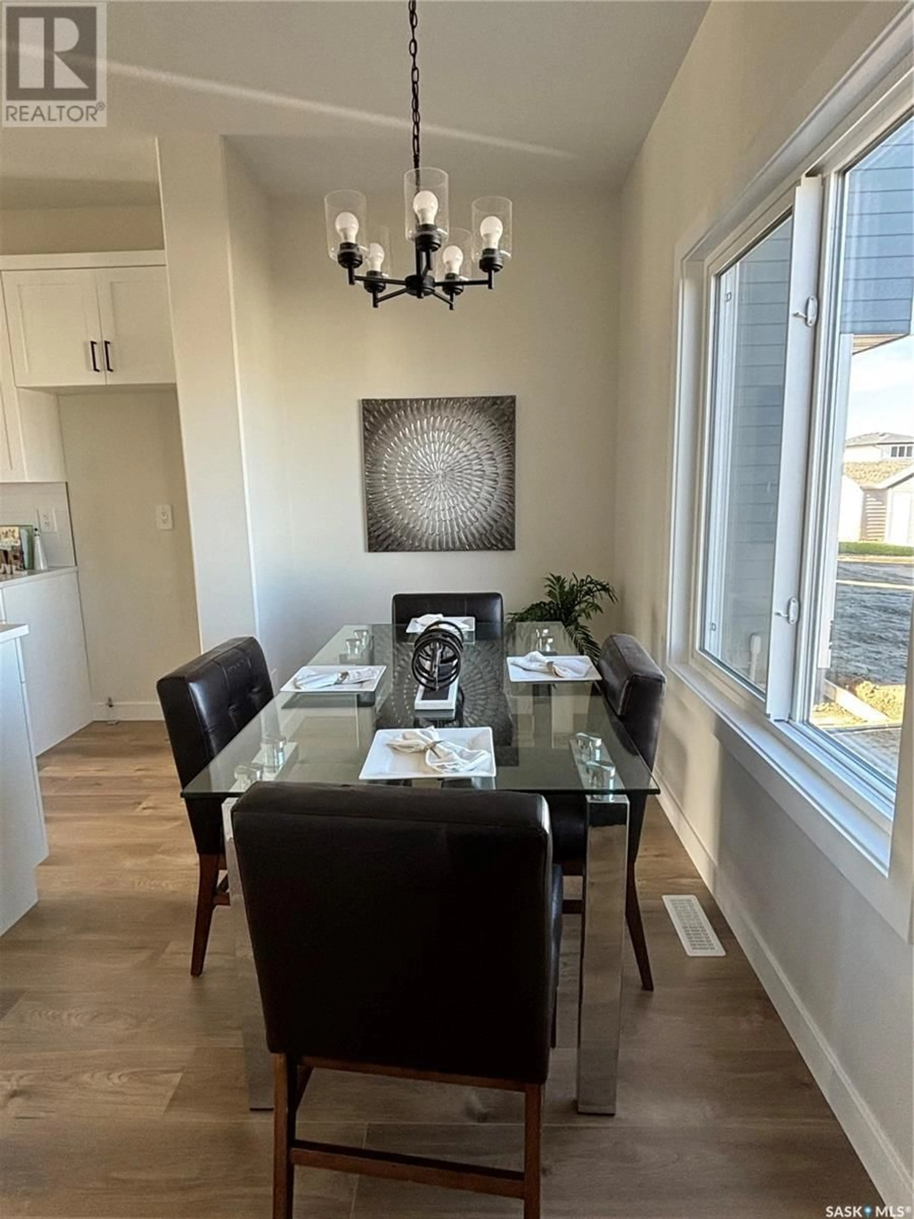 Dining room, wood/laminate floor for 183 Kostiuk CRESCENT, Saskatoon Saskatchewan S7V1R7