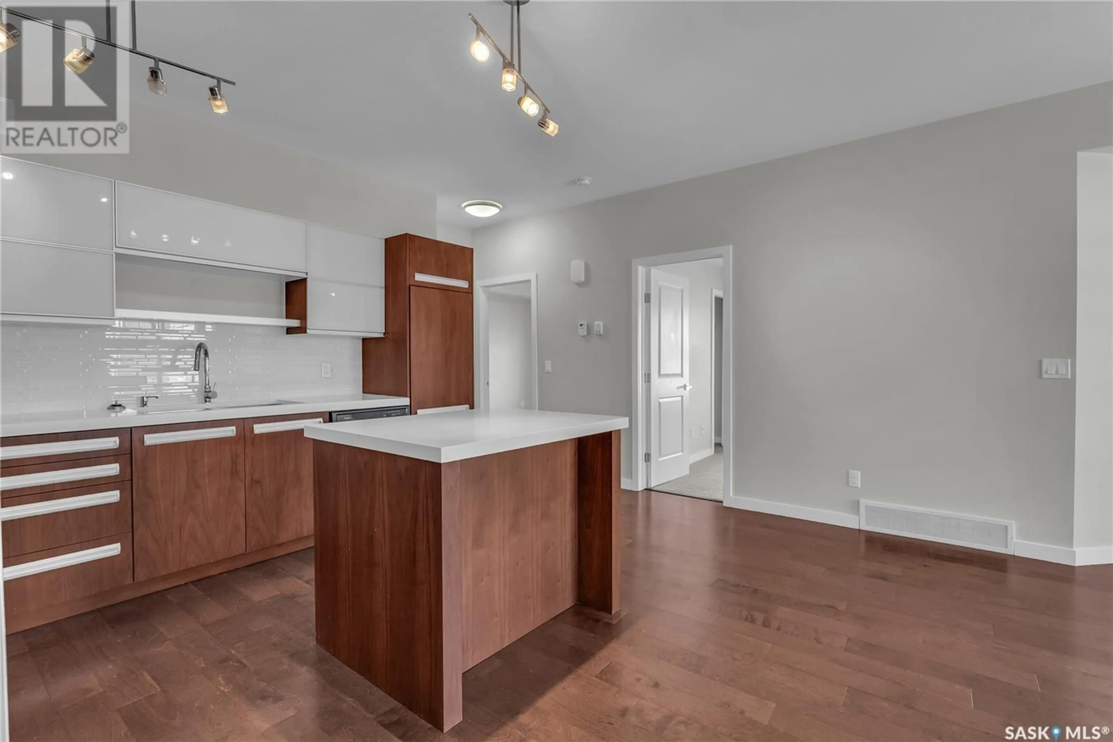 Open concept kitchen, wood/laminate floor for 120 2315 McClocklin ROAD, Saskatoon Saskatchewan S7R0K8