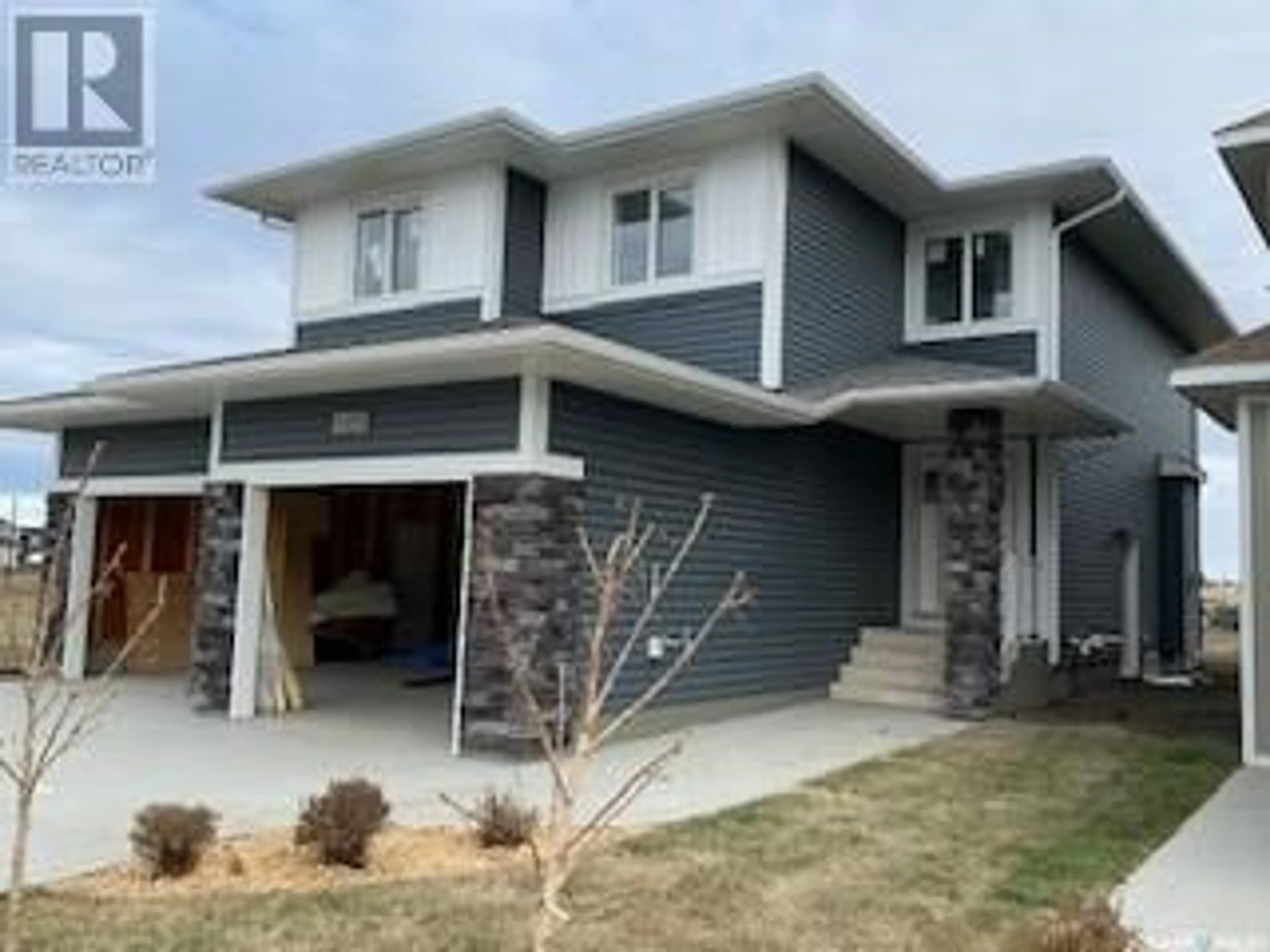 Home with vinyl exterior material, street for 118 Katz AVENUE, Saskatoon Saskatchewan S7V1S9