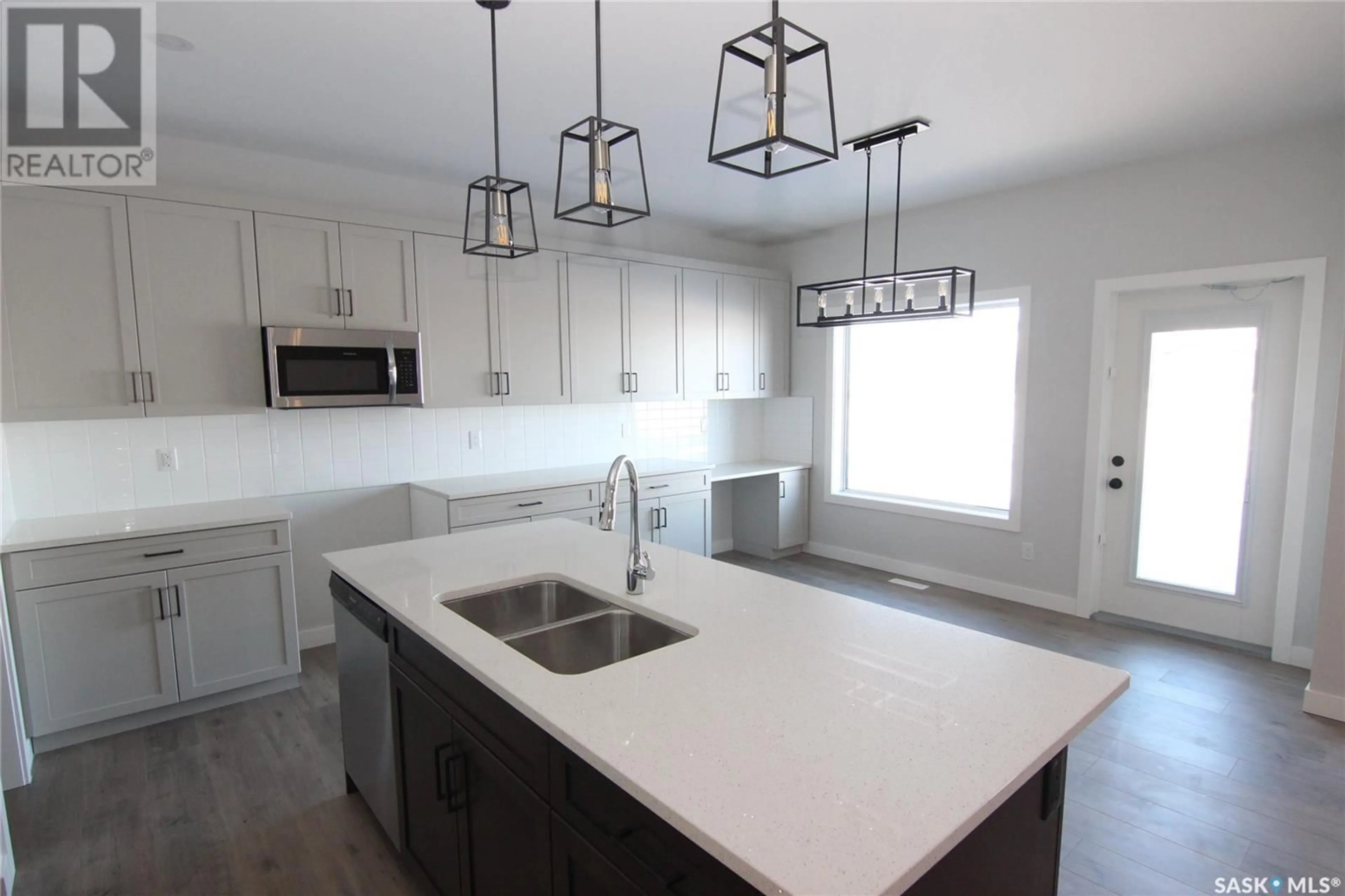 Open concept kitchen, ceramic/tile floor for 106 Katz AVENUE, Saskatoon Saskatchewan S7V1S9