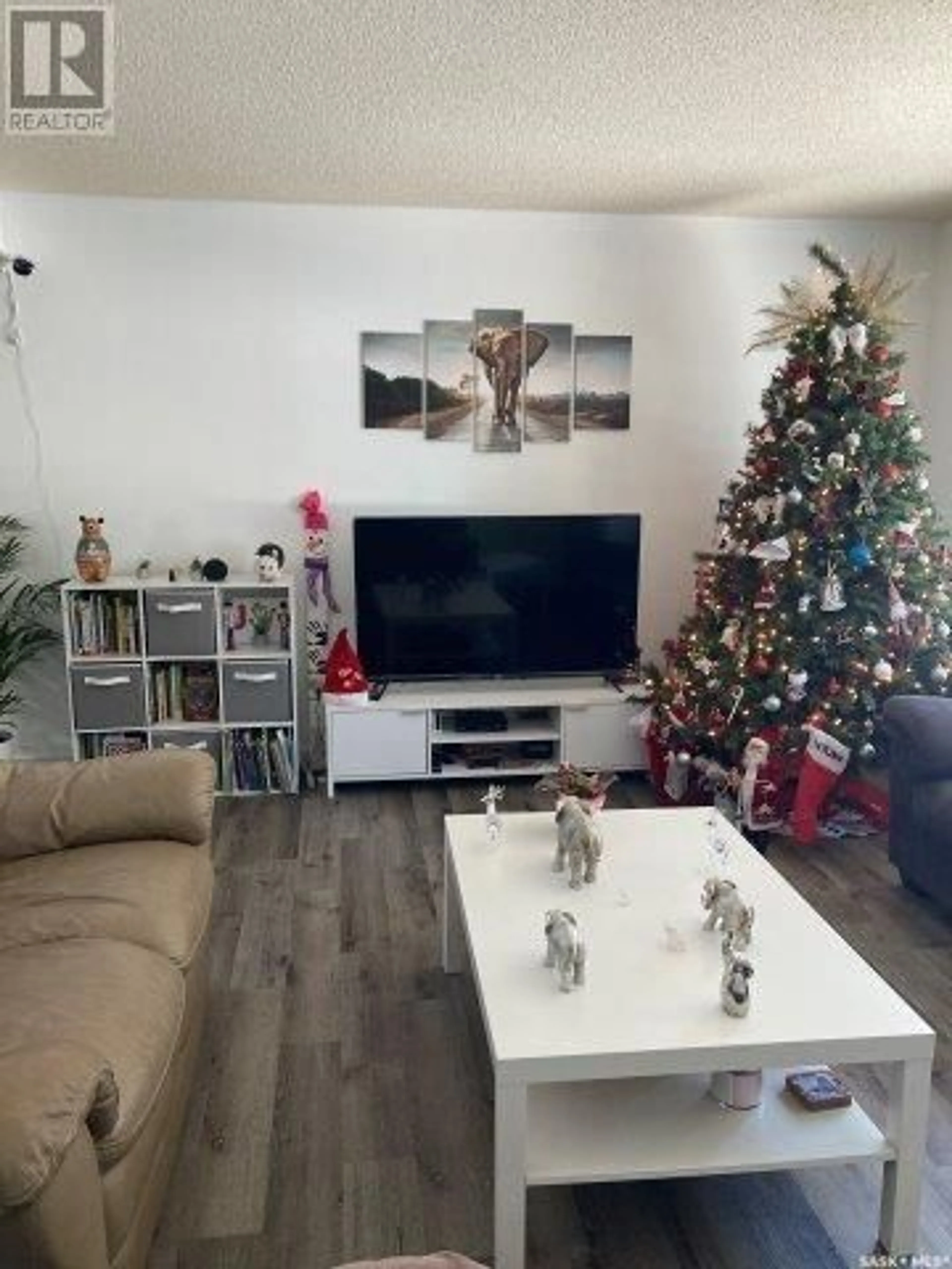 Living room with furniture, wood/laminate floor for 212 Fourth STREET NE, Ituna Saskatchewan S0A1N0