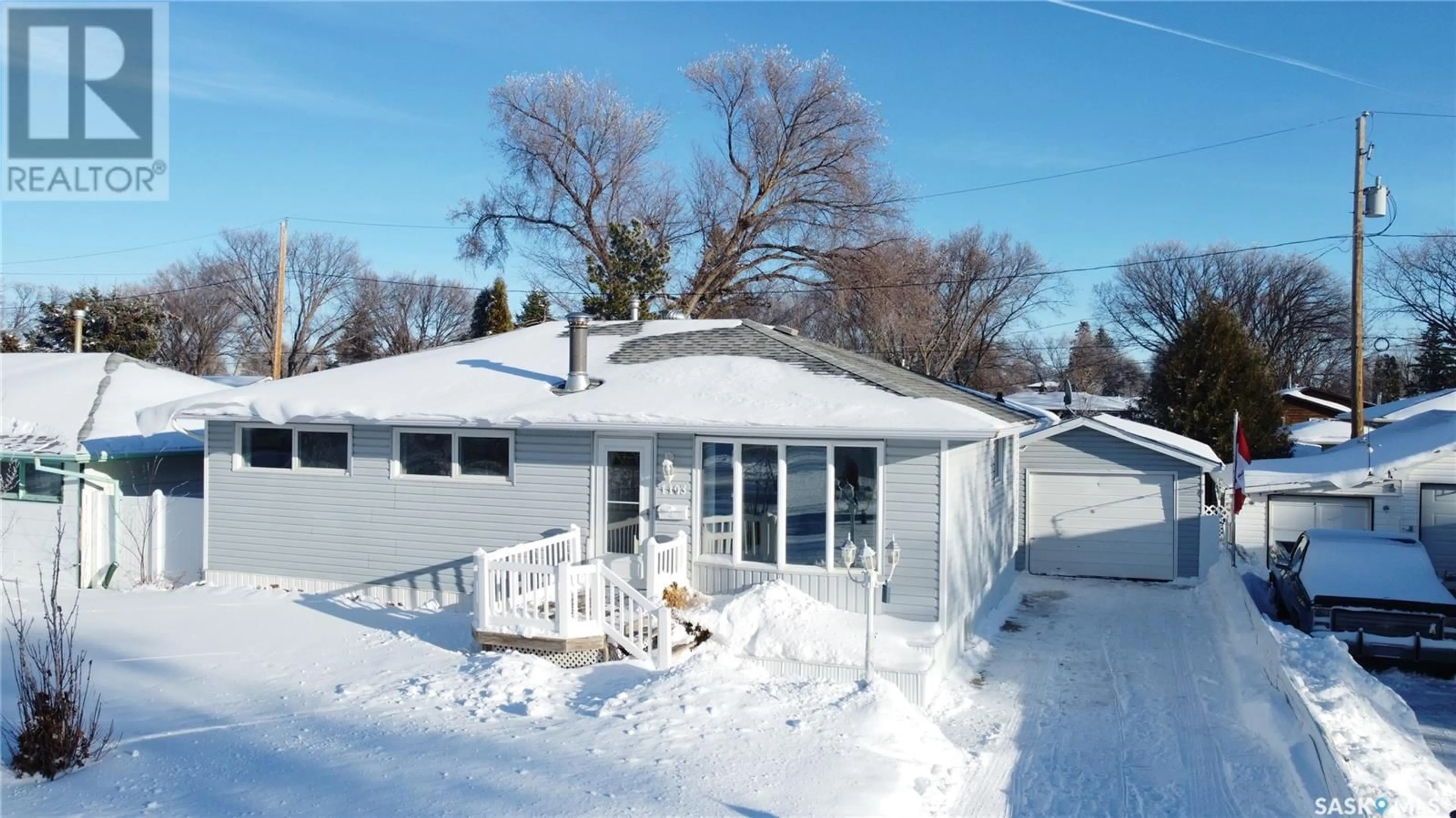 A pic from outside/outdoor area/front of a property/back of a property/a pic from drone, street for 1103 Simpson AVENUE, Moose Jaw Saskatchewan S6H4M7