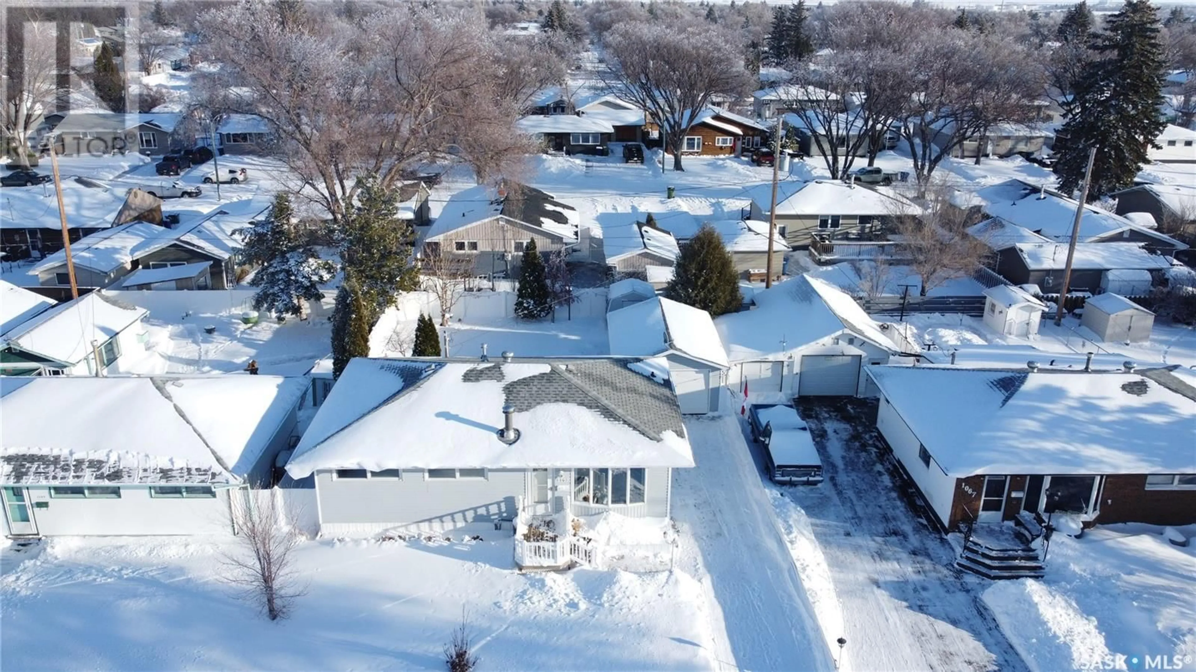 A pic from outside/outdoor area/front of a property/back of a property/a pic from drone, street for 1103 Simpson AVENUE, Moose Jaw Saskatchewan S6H4M7