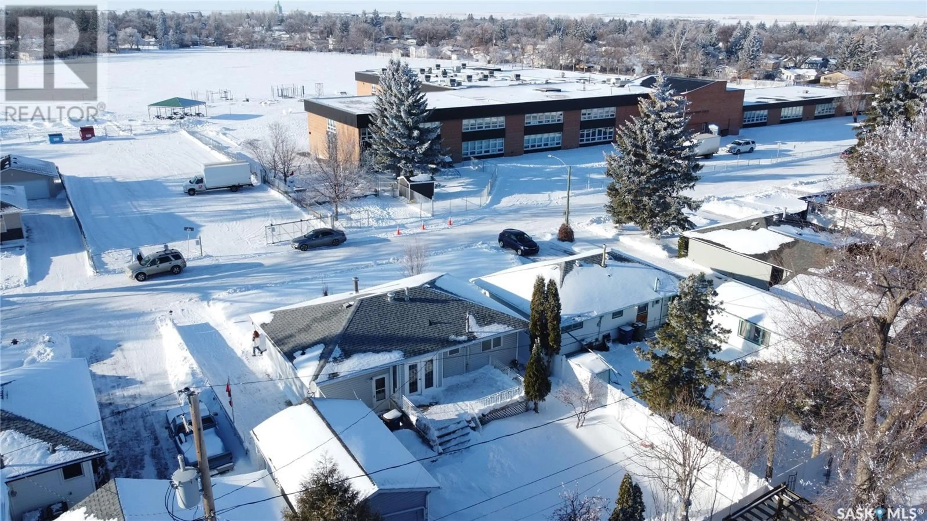 A pic from outside/outdoor area/front of a property/back of a property/a pic from drone, street for 1103 Simpson AVENUE, Moose Jaw Saskatchewan S6H4M7