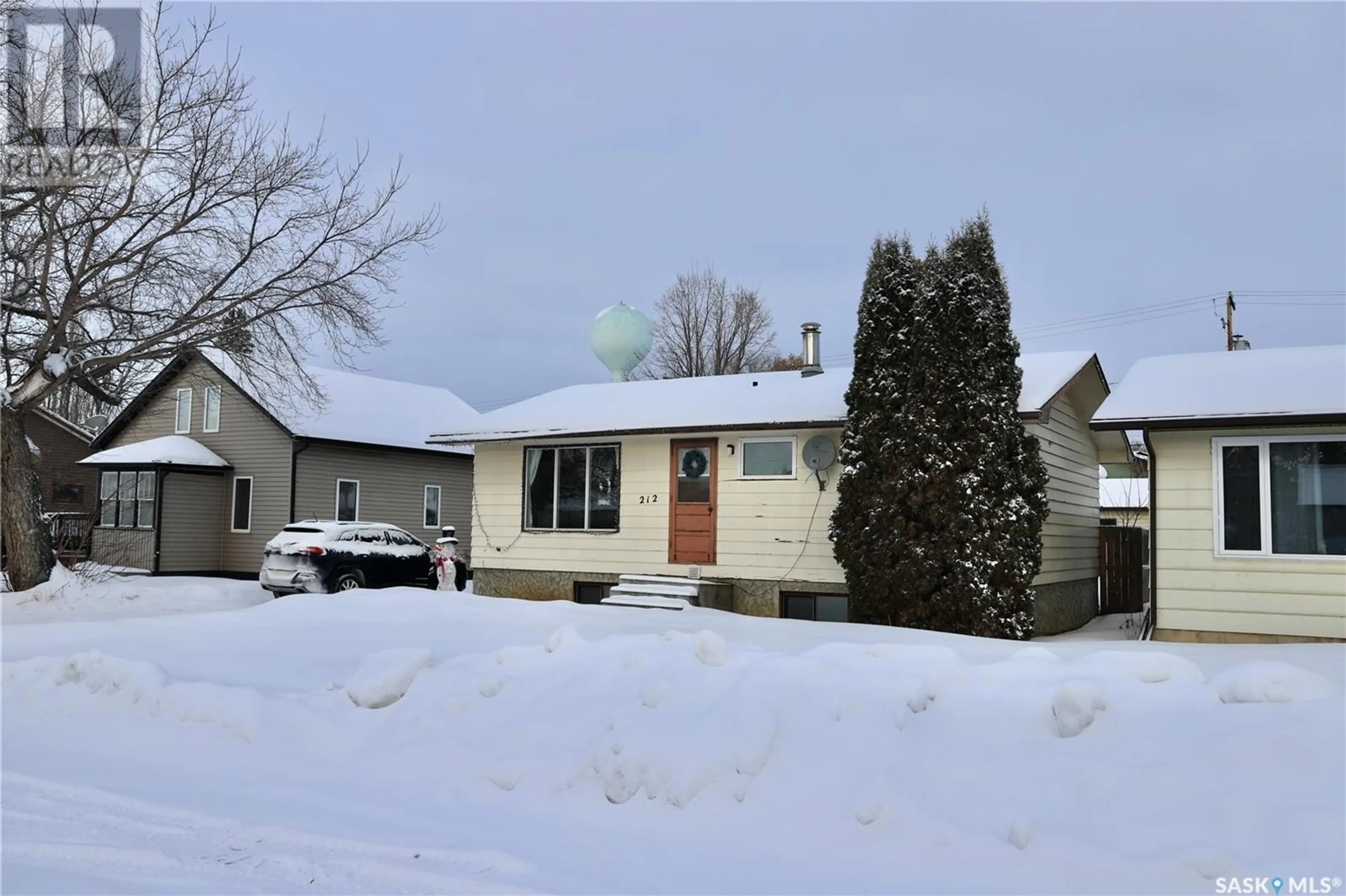 Home with vinyl exterior material, street for 212 3rd AVENUE E, Shellbrook Saskatchewan S0J2E0