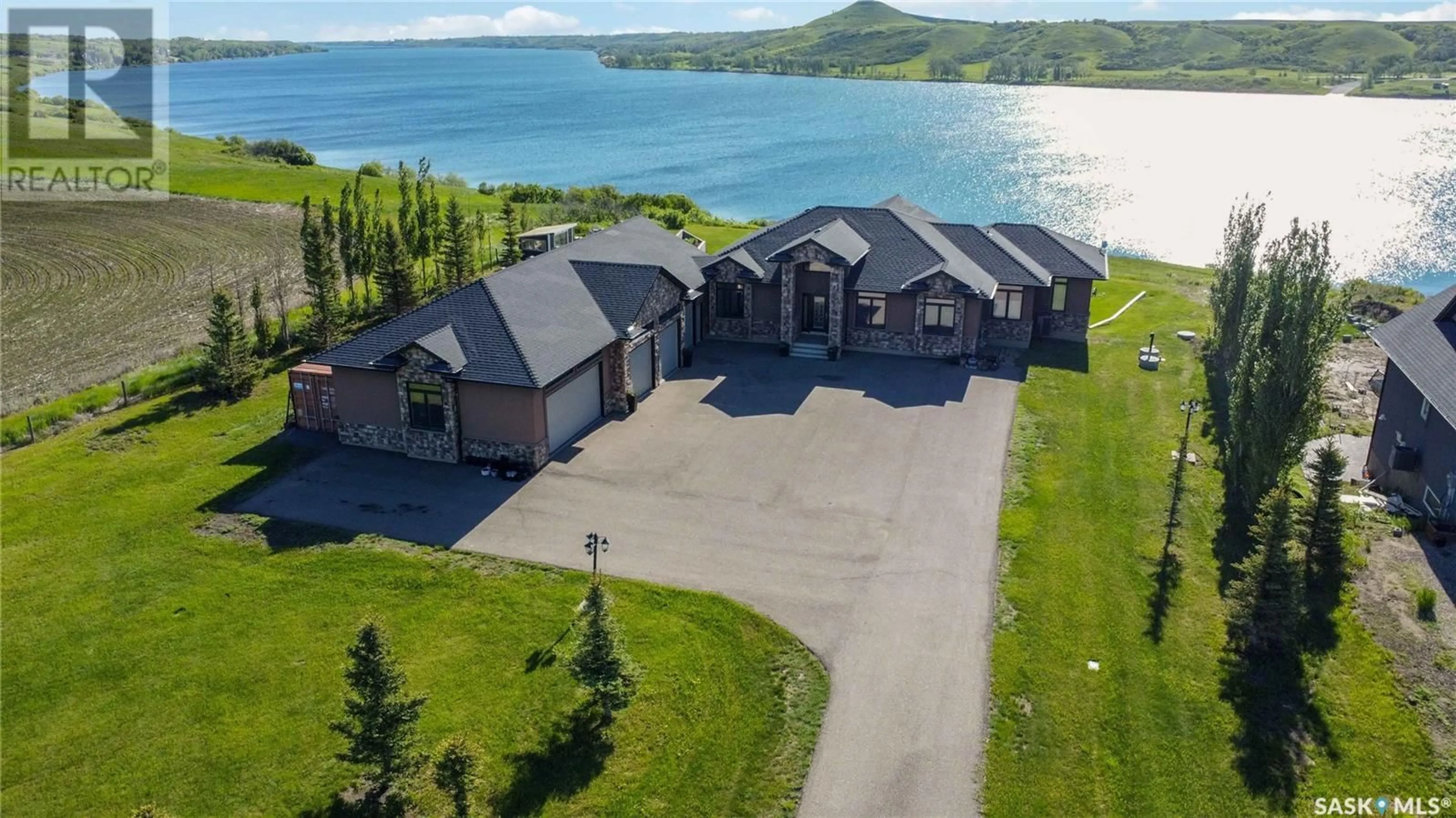 A pic from outside/outdoor area/front of a property/back of a property/a pic from drone, water/lake/river/ocean view for 35 Sunrise DRIVE, Blackstrap Skyview Saskatchewan S7C0A6