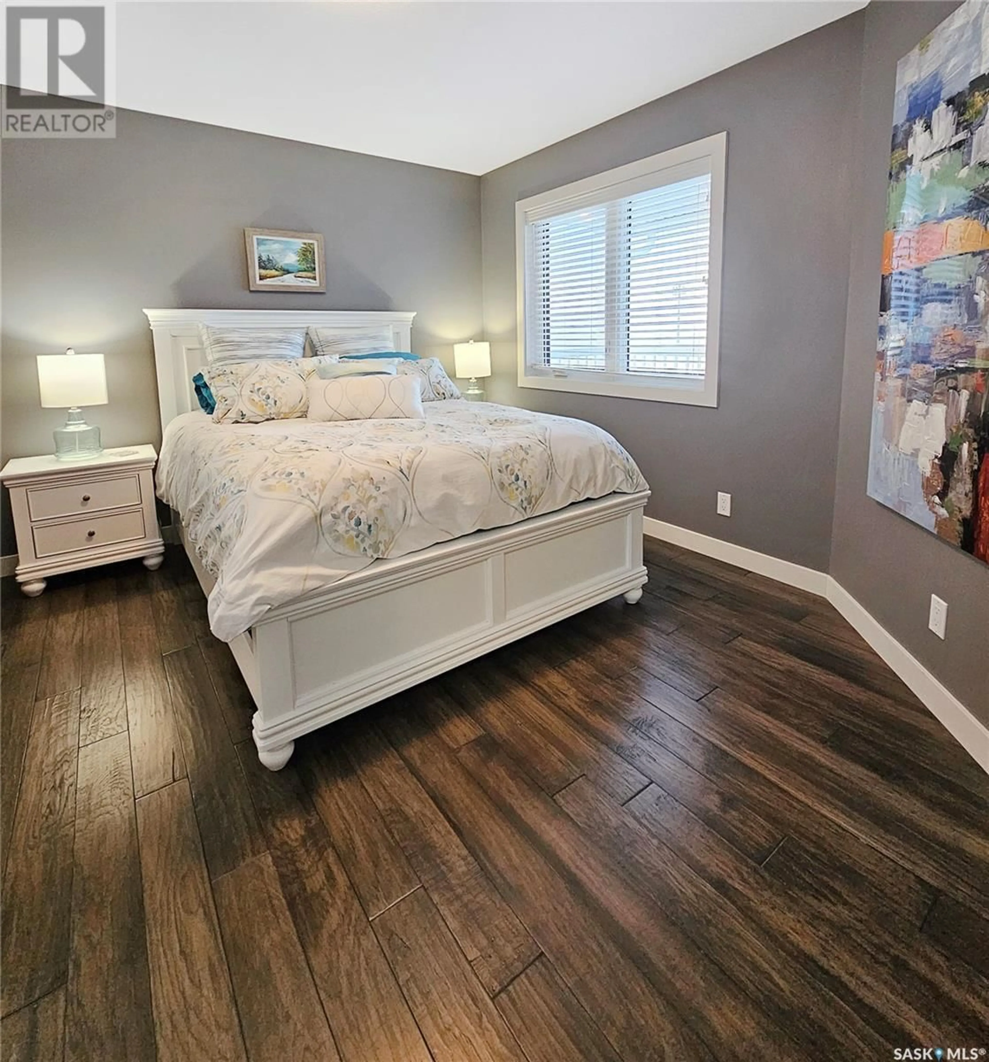 Bedroom with bed, wood/laminate floor for 812 Battleford TRAIL, Swift Current Saskatchewan S9H5R1