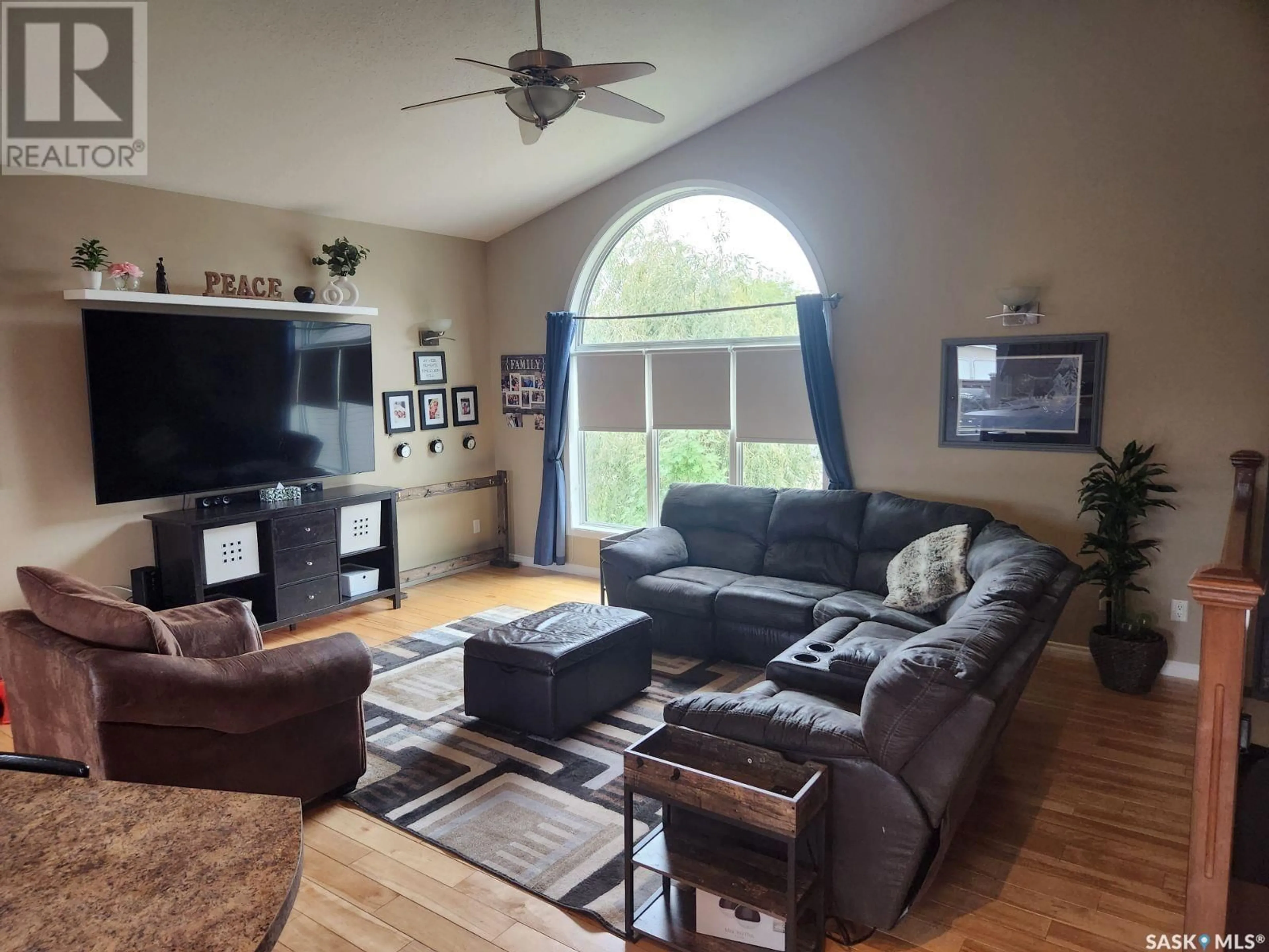 Living room with furniture, wood/laminate floor for 38 Morin CRESCENT, Meadow Lake Saskatchewan S9X1Z8