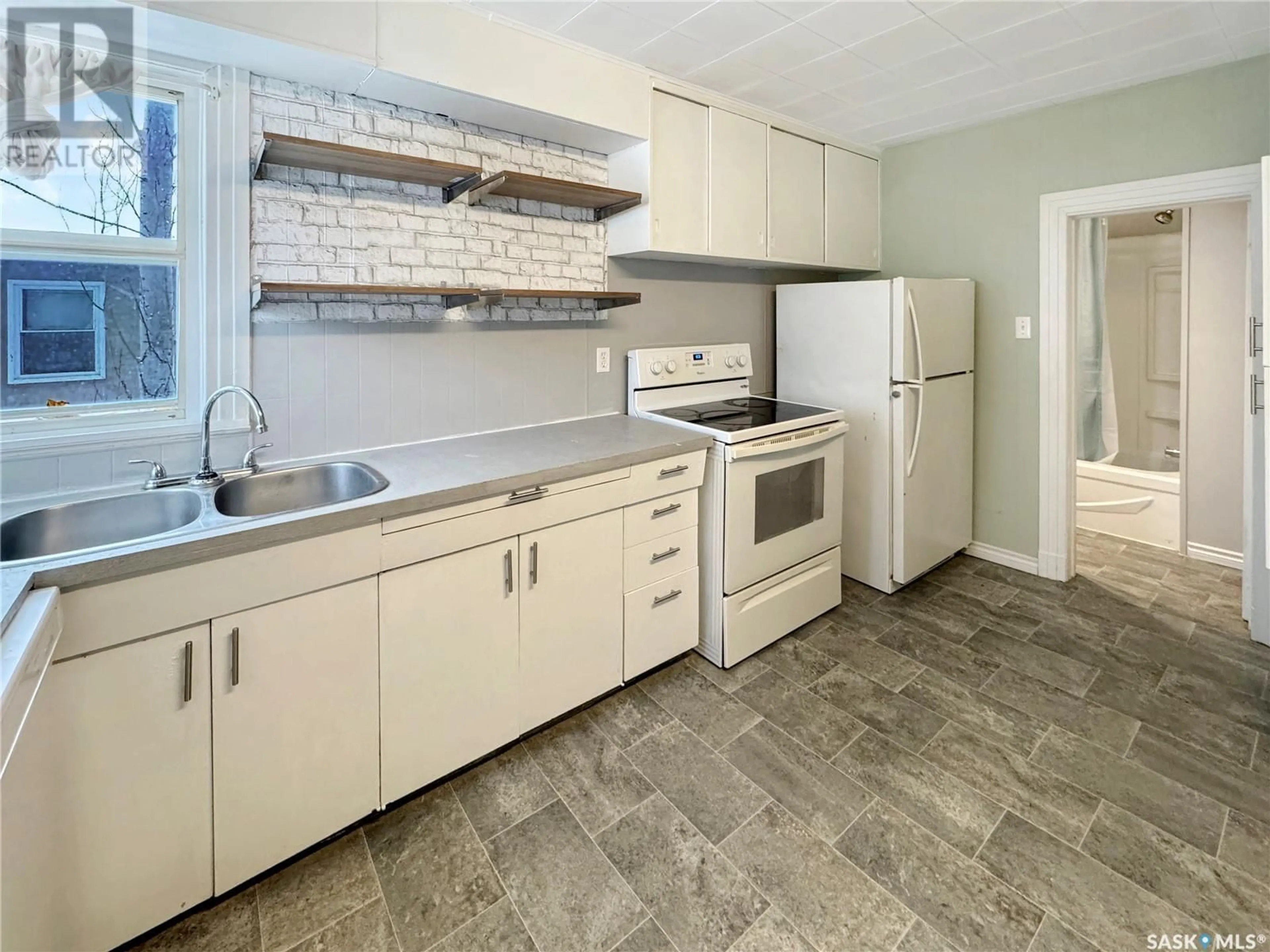 Standard kitchen, ceramic/tile floor for 1441 103RD STREET, North Battleford Saskatchewan S9A1L2