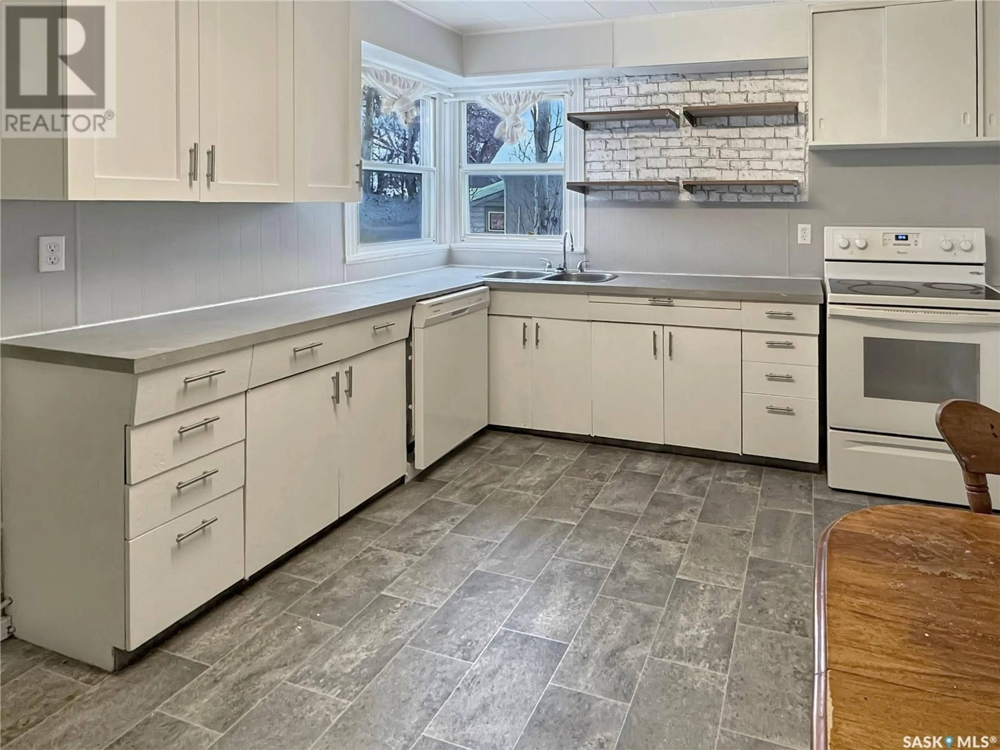 Open concept kitchen, ceramic/tile floor for 1441 103RD STREET, North Battleford Saskatchewan S9A1L2