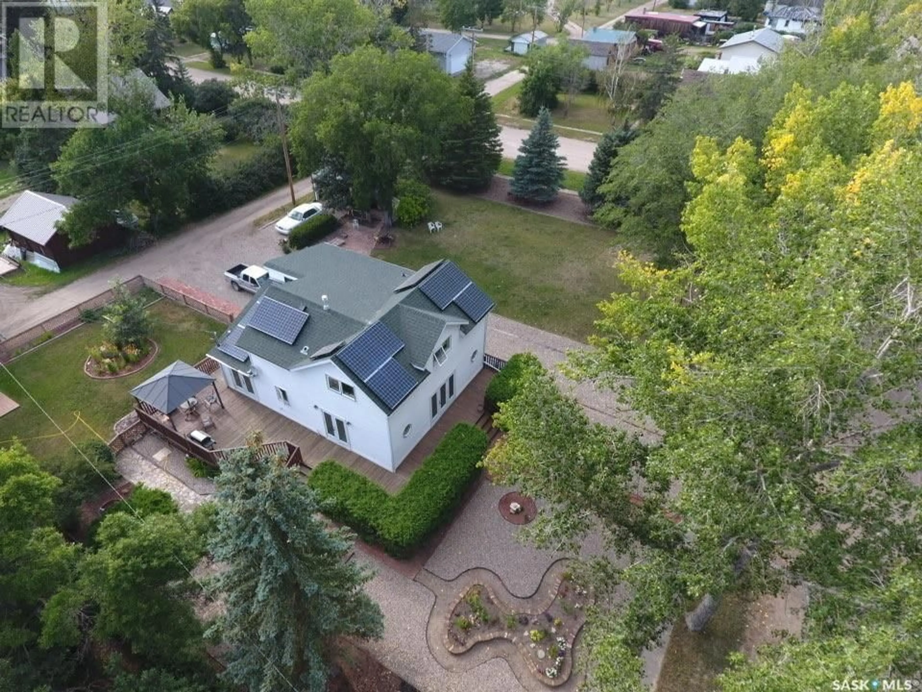 A pic from outside/outdoor area/front of a property/back of a property/a pic from drone, unknown for 106 2nd STREET E, Dinsmore Saskatchewan S0L0T0