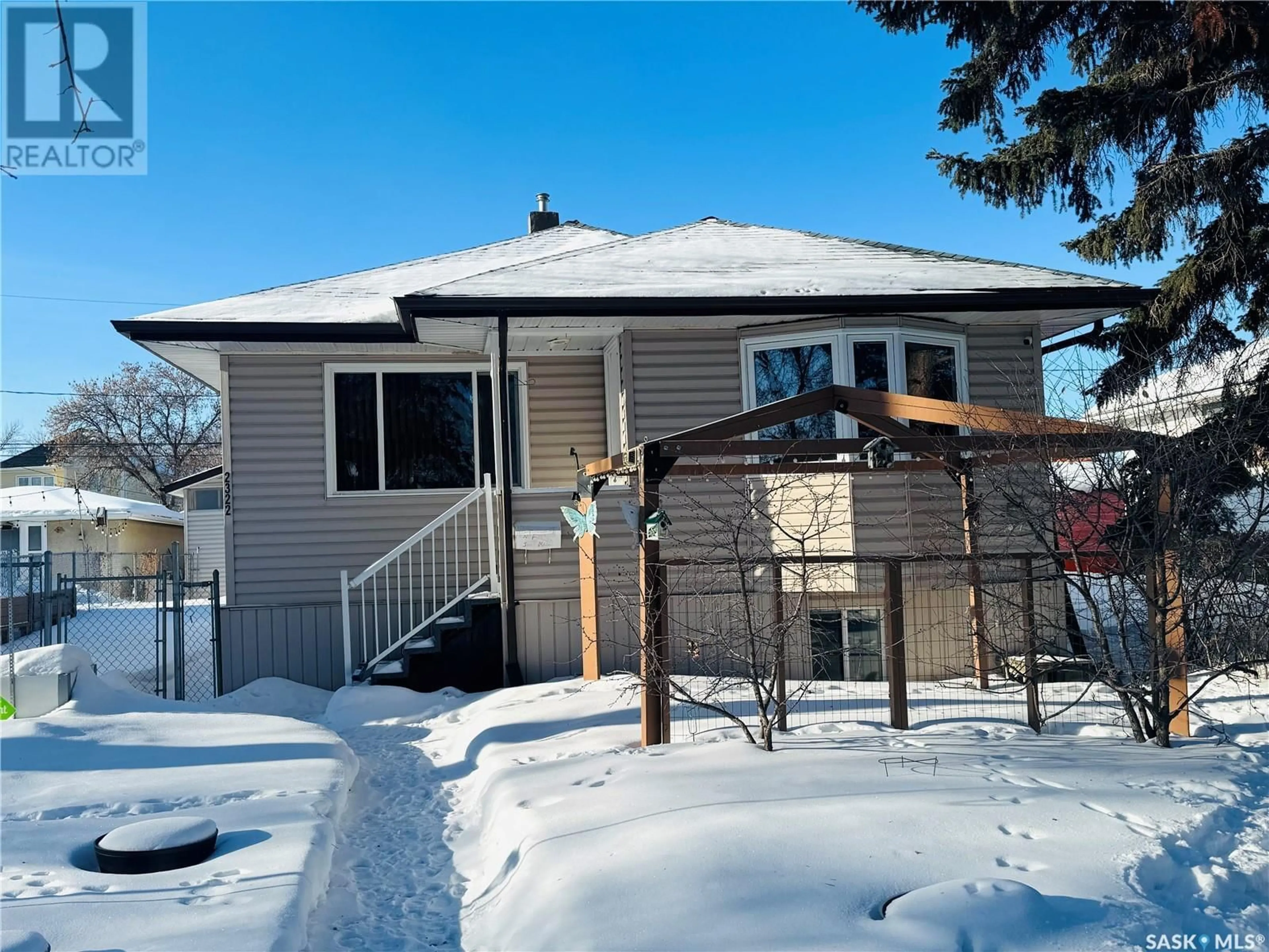 Home with vinyl exterior material, street for 2322 MacKay STREET, Regina Saskatchewan S4N2T1