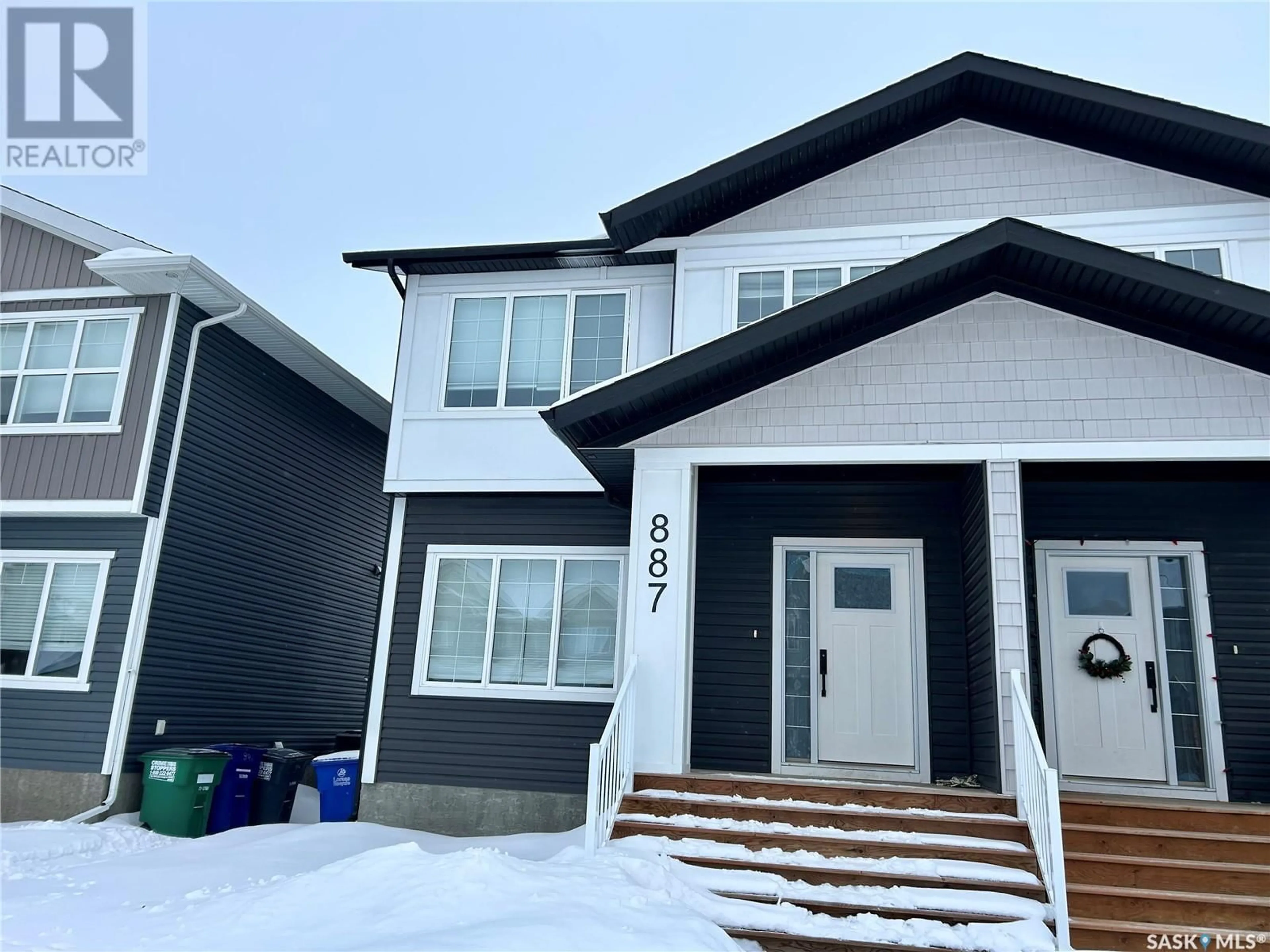 Home with vinyl exterior material, street for 887 McFaull RISE, Saskatoon Saskatchewan S7V0S9