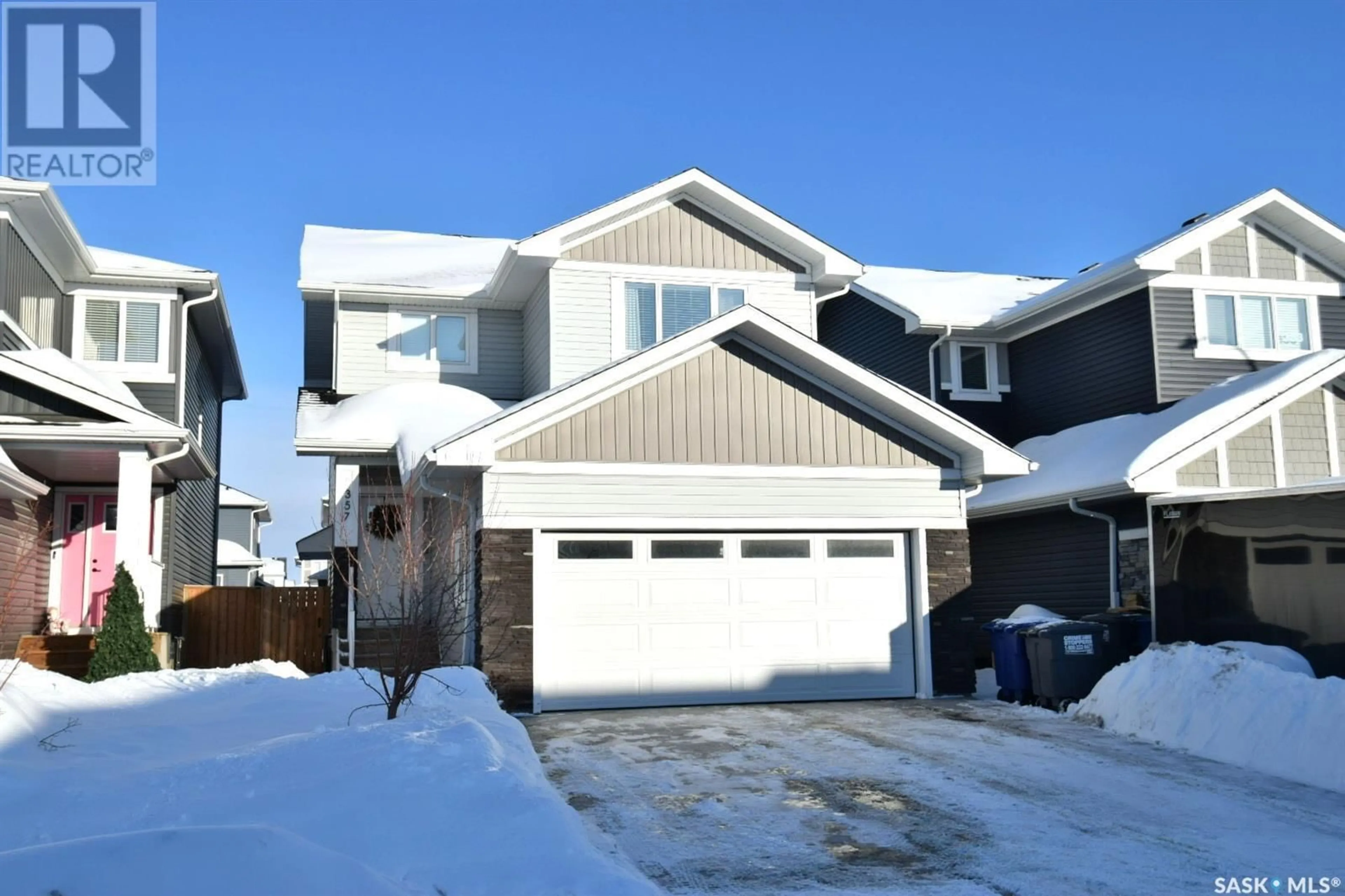 Home with vinyl exterior material, street for 357 Germain MANOR, Saskatoon Saskatchewan S7V0T7