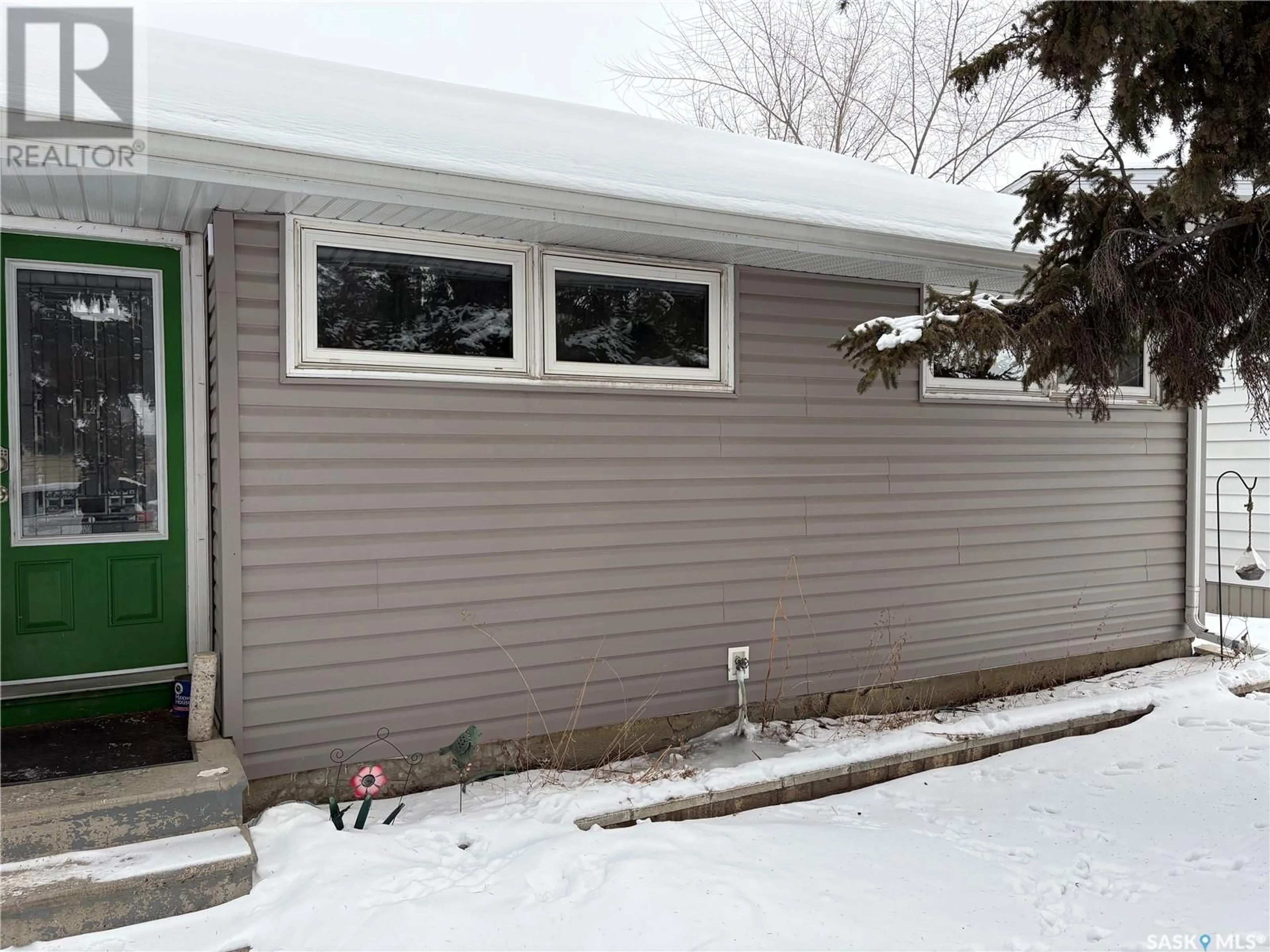 Home with vinyl exterior material, street for 2333 Clarence AVENUE S, Saskatoon Saskatchewan S7L1L8