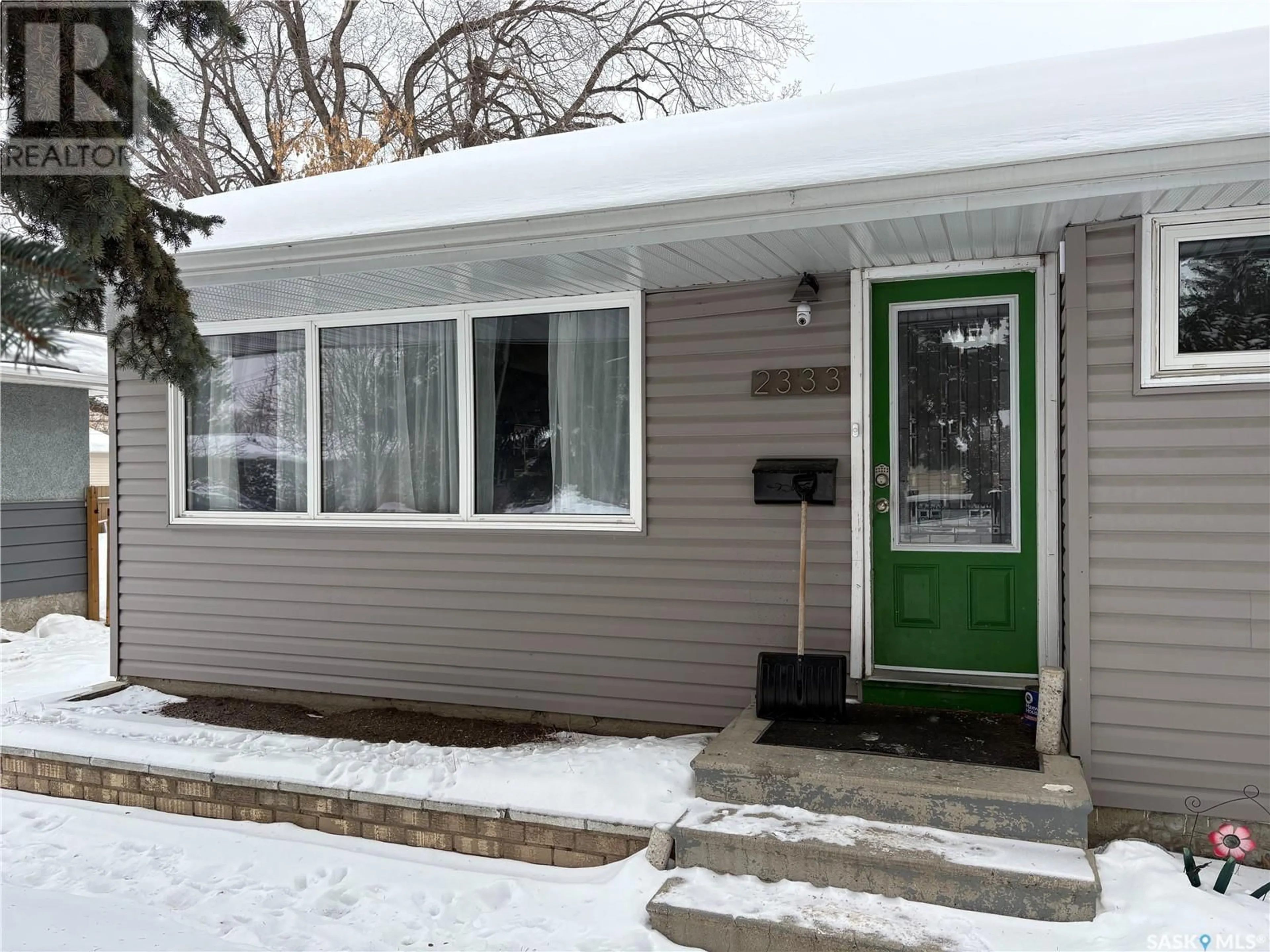 Home with vinyl exterior material, street for 2333 Clarence AVENUE S, Saskatoon Saskatchewan S7L1L8