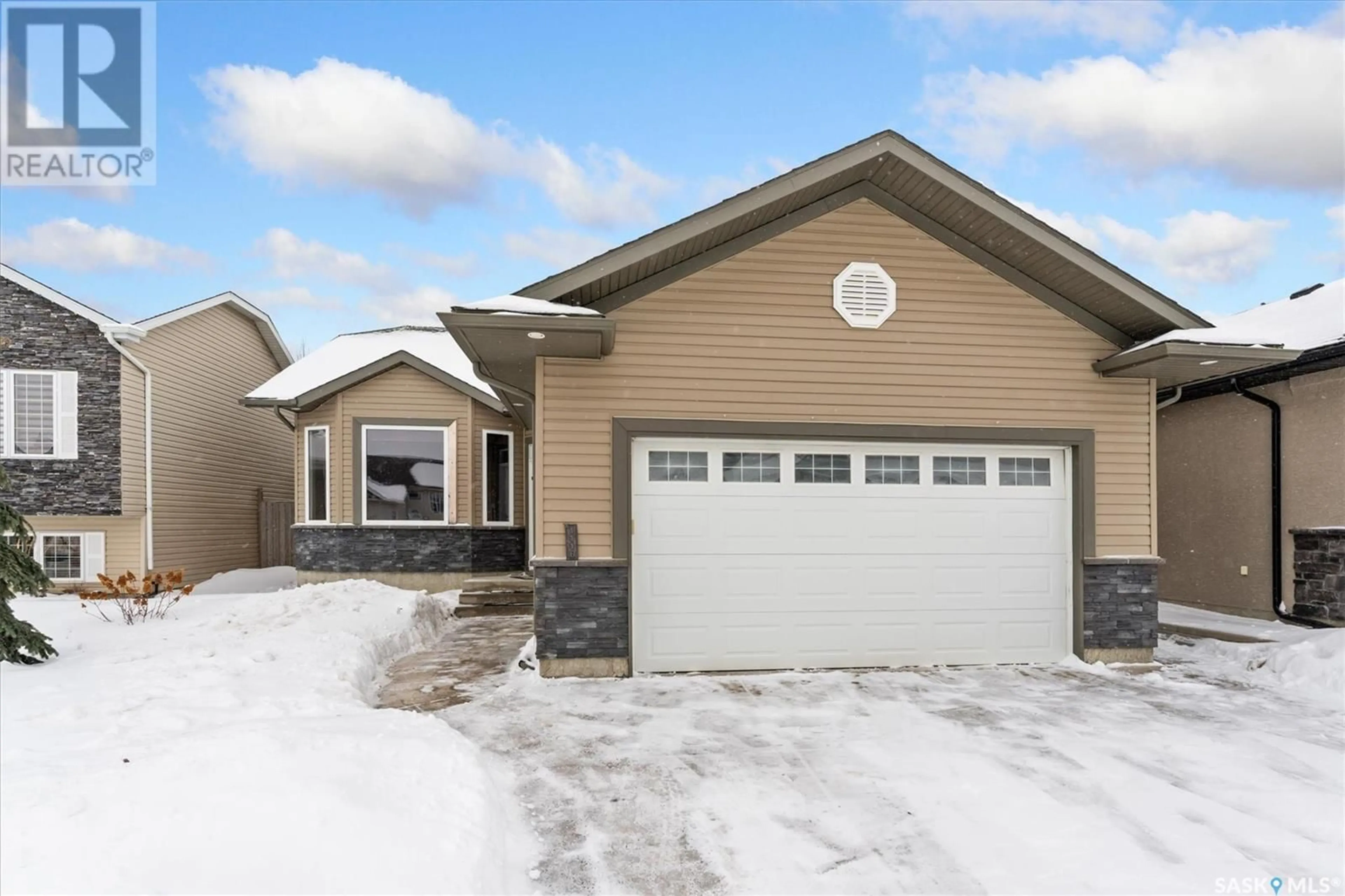 Home with vinyl exterior material, street for 1118 Paton LANE, Saskatoon Saskatchewan S7W0C1